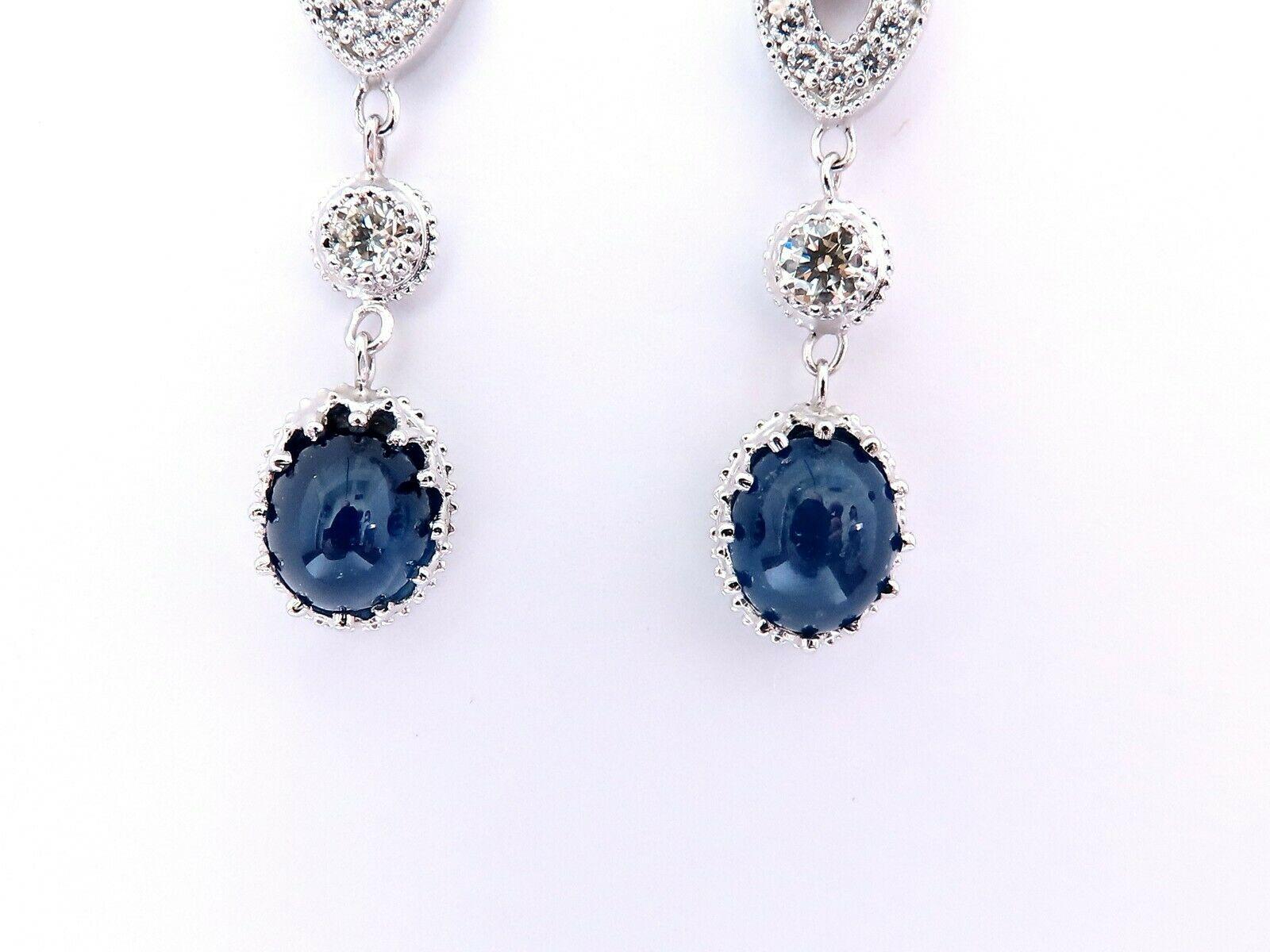 Cabochon dangles statement earrings.

4.33 carat natural oval sapphires.

Royal blue, clean clarity and transparent.

7.5 x 5.5 mm each.

1.10ct natural round diamonds.

G color vs2 clarity

14kt white gold 7.8 grams.

$8,000 appraisal certificate