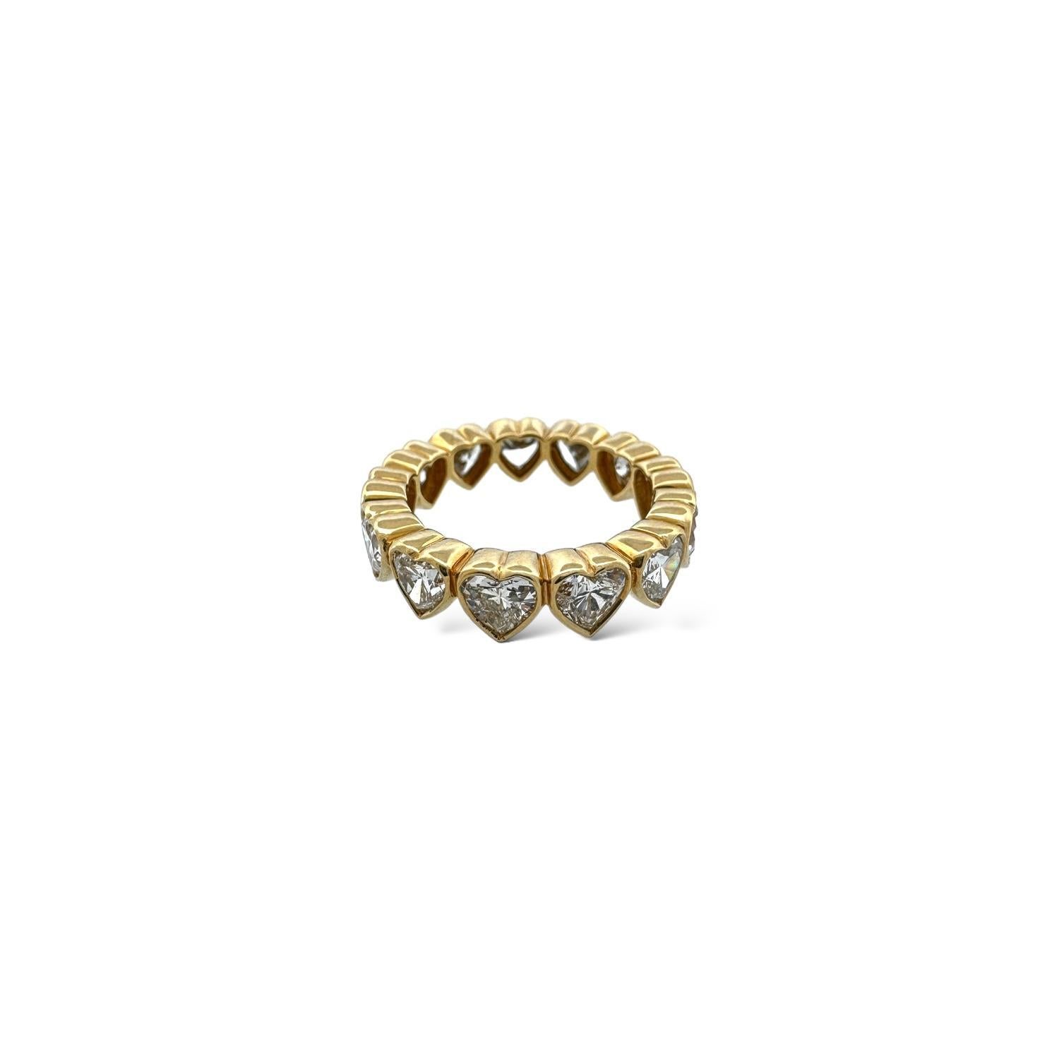 4.33ctw G VS2 HS DIAS, 13 STONES, BEZEL SET

This elegant 18K yellow gold band features 13 diamonds with VS2 clarity, heart-cut for brilliance, totaling 4.33 carats. Designed for size 6.5, it weighs 5.80 grams, blending luxury and timeless beauty
