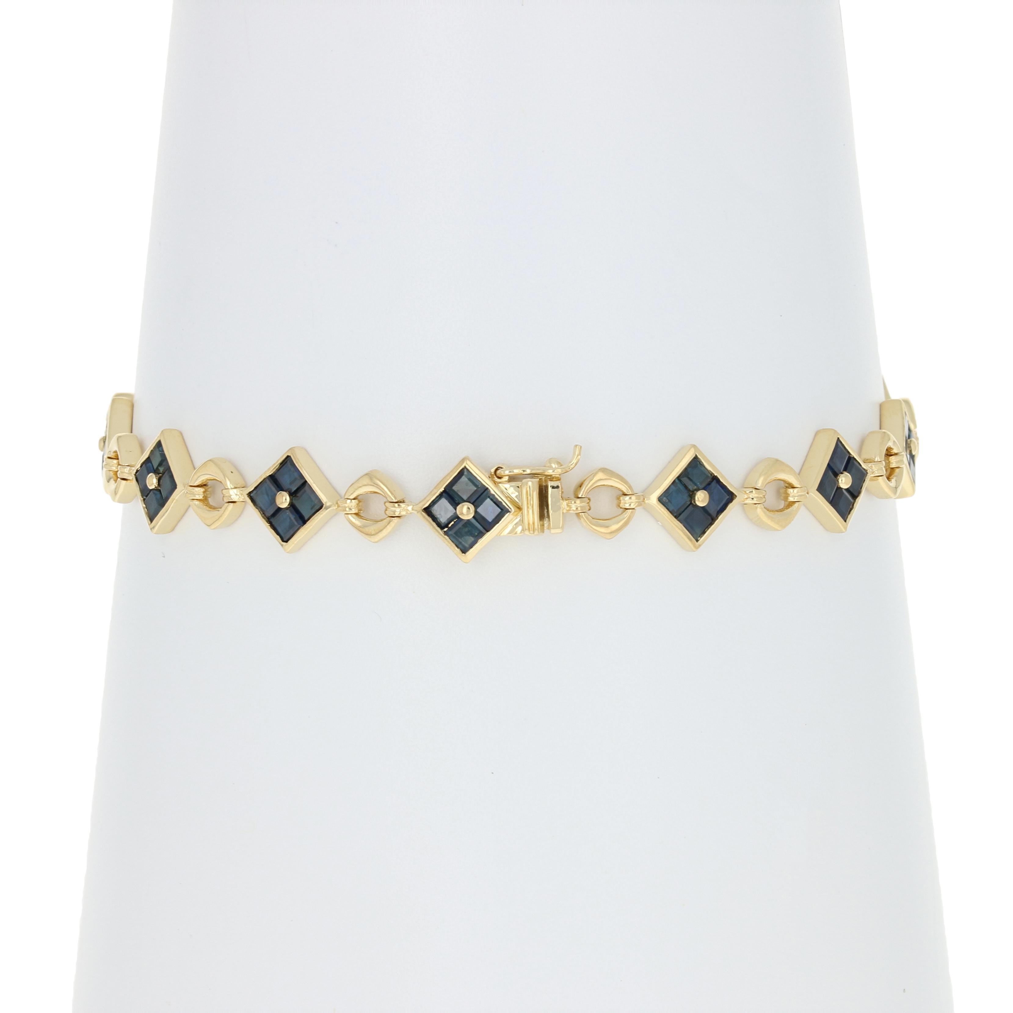 Add an elegant splash of color to your day or evening ensembles with this gorgeous piece! Crafted in luxurious 18k yellow gold, this contemporary link bracelet showcases rich blue sapphires arranged into square-shaped formations.   

Metal Content: