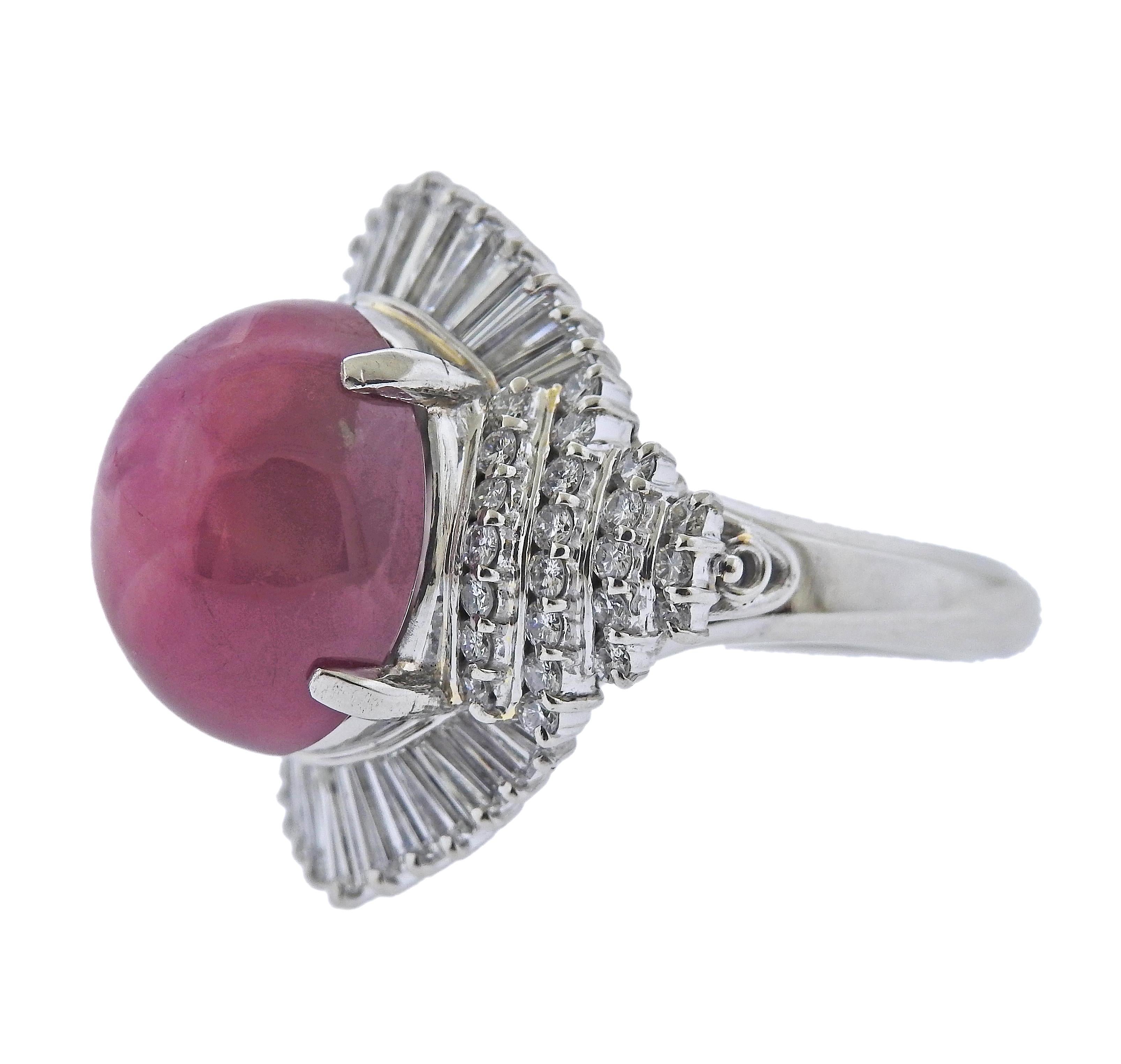 Platinum cocktail ring, with center 4.34ct ruby cabochon ( stone measures approx. 13.7 x 11.5 x 9.5mm). Surrounded with 1.44ctw in diamonds. Ring size - 6.5, ring top - 22mm x 21mm. Marked: BO 4.34, Pt900, 1.44. Weight - 15.8 grams.