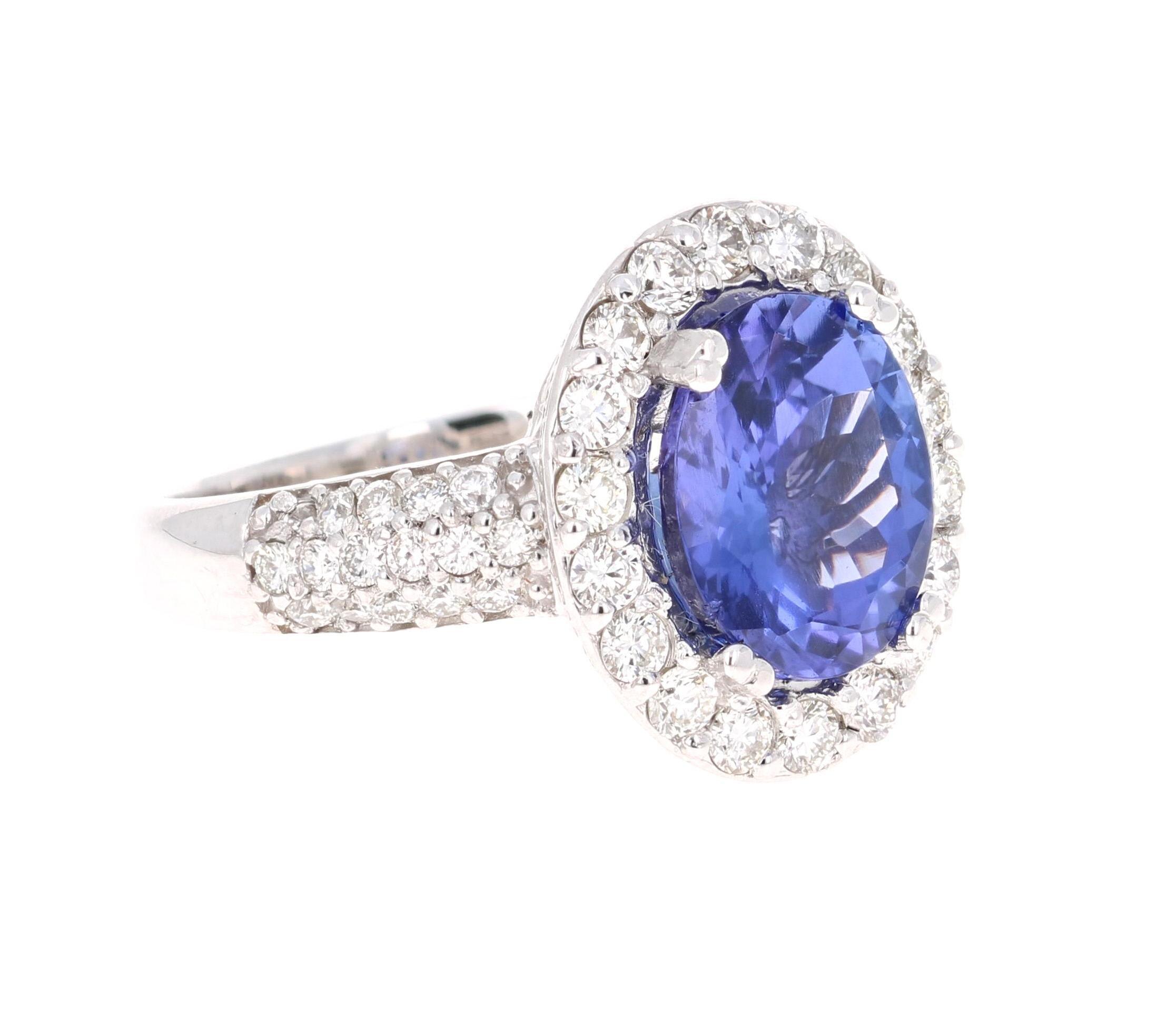 Elegant & Classic Tanzanite Diamond Ring! 

This ring has a radiant bluish-purple Oval Cut Tanzanite weighing 3.30 Carats. It is surrounded by 62 Round Cut Diamonds that weigh 1.04 Carats with a clarity and color of VS-H. The total carat weight of
