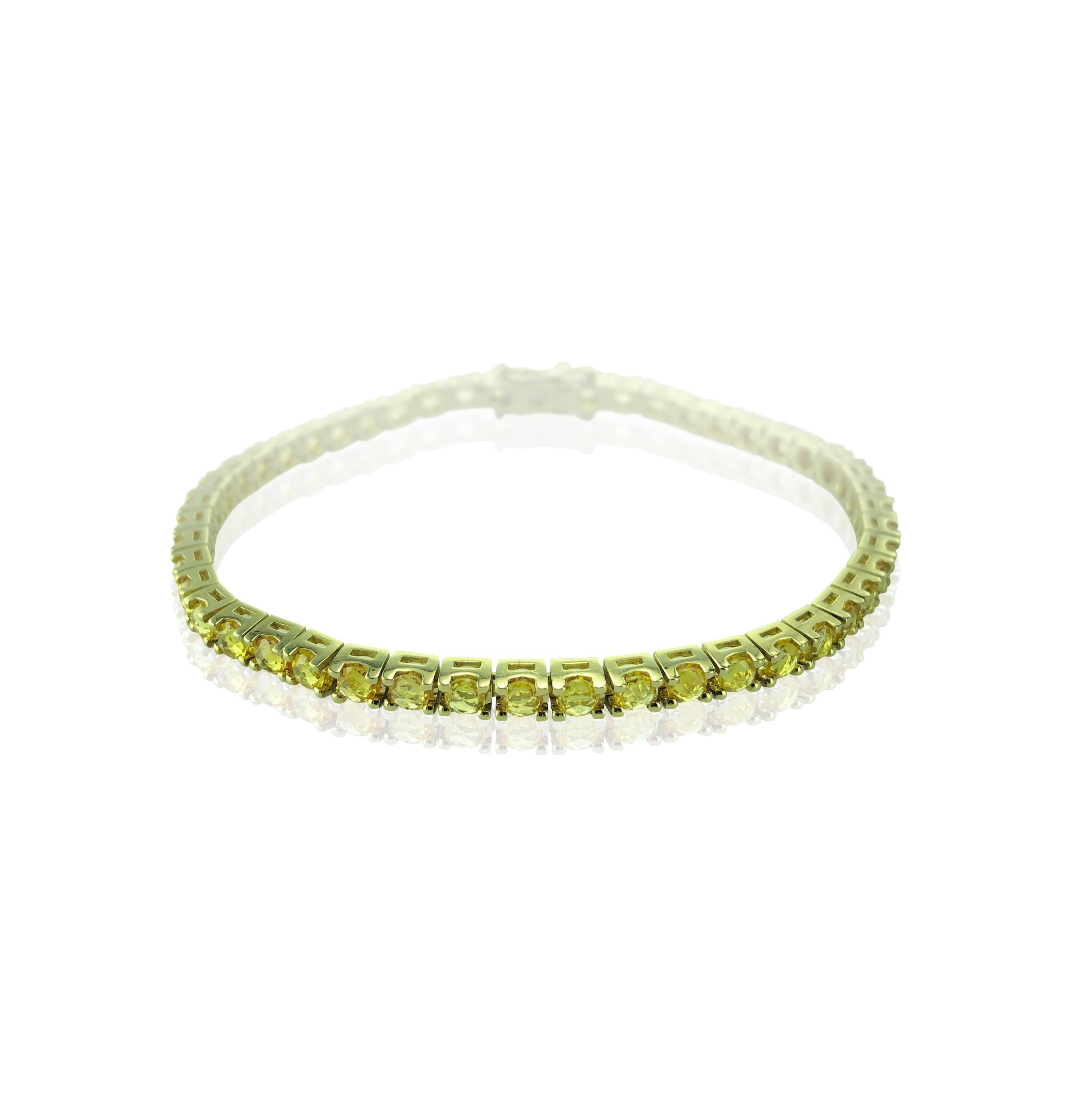 This 4.34 Carat Yellow Sapphire & 18Kt Yellow Gold Unisex Tennis Bracelet, suits any attire whatever the occasion or time of day. 

It beautifully sparkles and can be adored alone or worn stacked with other bracelets. 

Unisex it looks equally