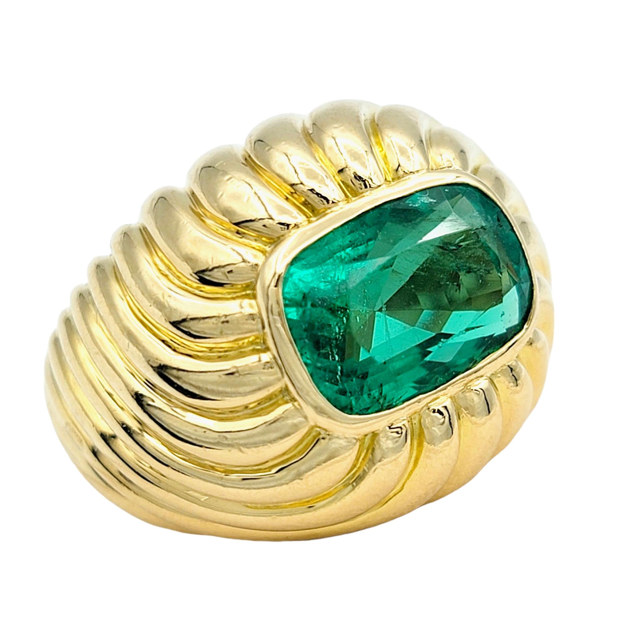 Contemporary 4.35 Carat Cushion Cut Emerald Solitaire Ridged Dome Ring 18 Karat Yellow Gold For Sale