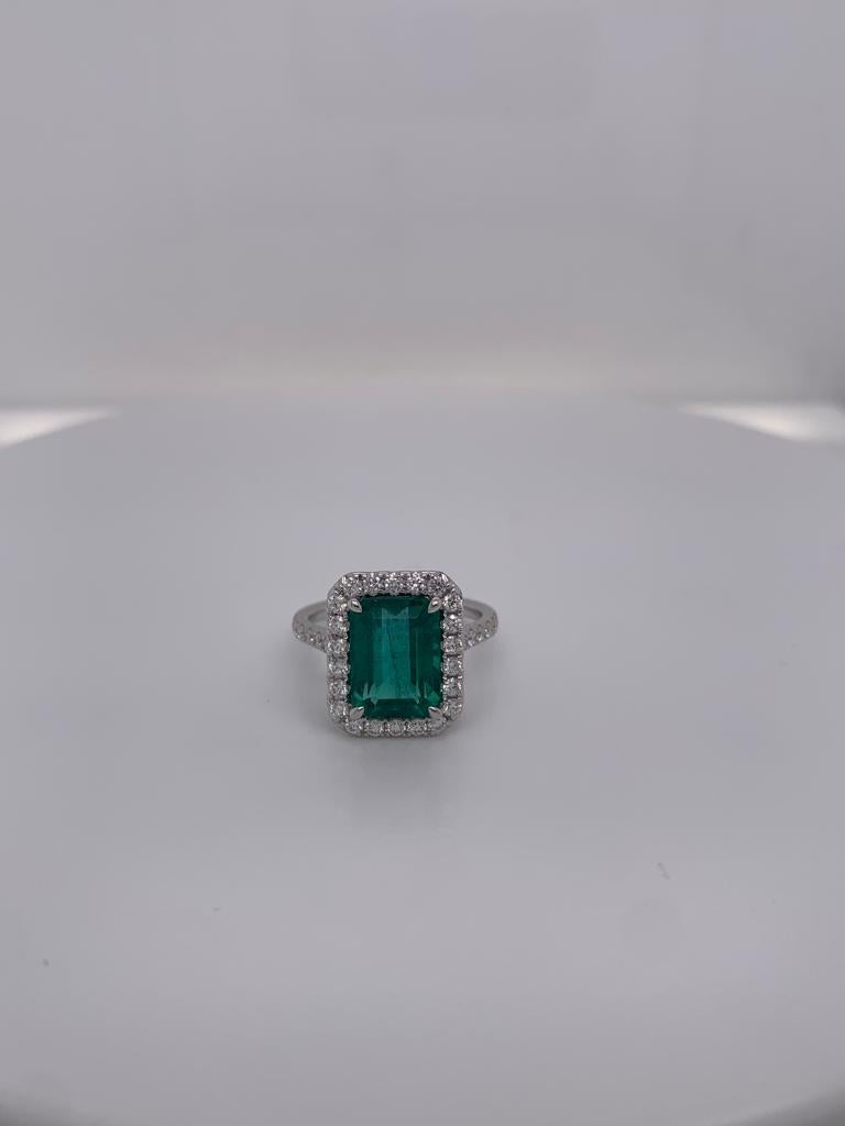 Emerald cut emerald weighing 4.35 cts
Measuring (11.1x8.0) mm
36 pieces of diamonds weighing .66 cts
Set in 18K white gold ring