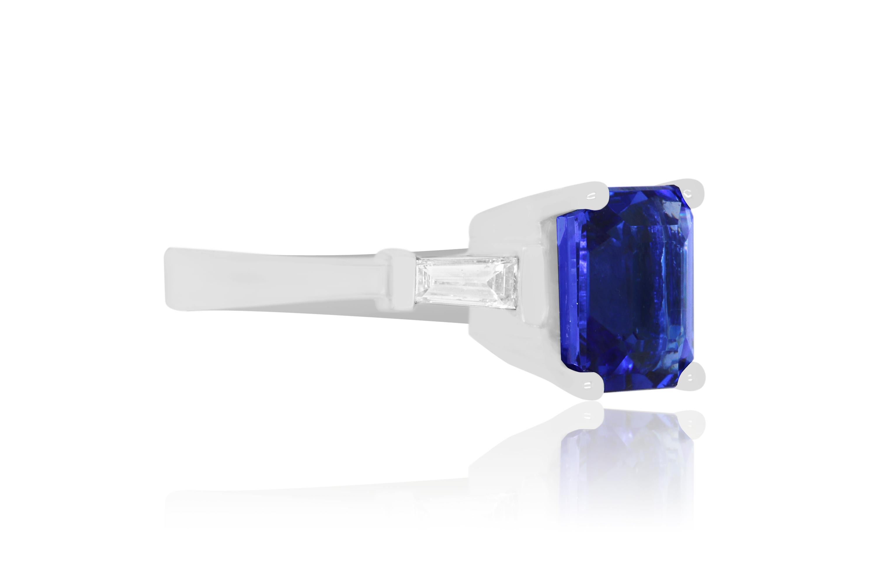 A stunning 4.35 Carat Emerald Cut Tanzanite is perfectly set in a 14K white gold and surrounded on either side by dazzling baguette diamonds totaling 0.36 Carats.

Material: 14k White Gold
Gemstones: 1 Emerald Cut Tanzanite at 4.35 Carats.