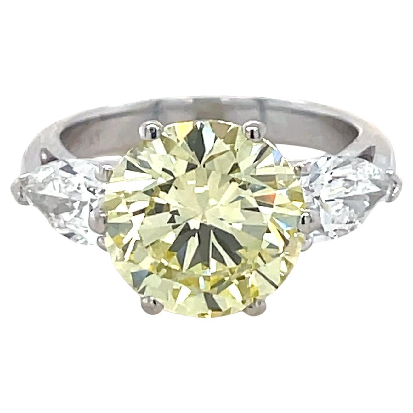 4.35 Carat Natural Fancy Yellow Diamond and Diamond Ring
