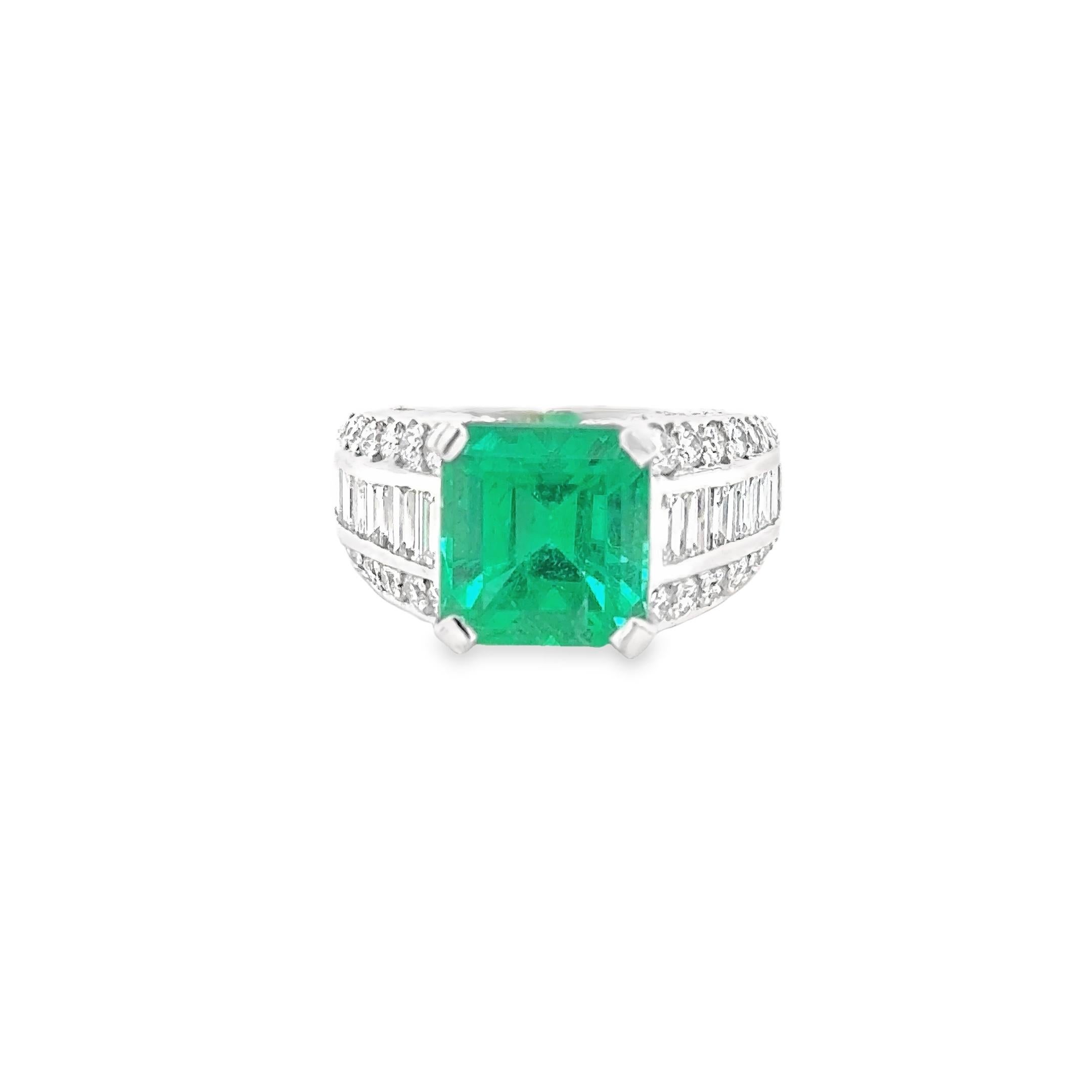 18k white gold hallmarked ring , set with one Octagonal mixed cut natural emerald and sixty six 66 round brilliant cut and baguette cut natural diamonds .
total jewellery weight 8.14gram 

Emerald Natural moderate oil Colombia 
Measurments :9.53 x