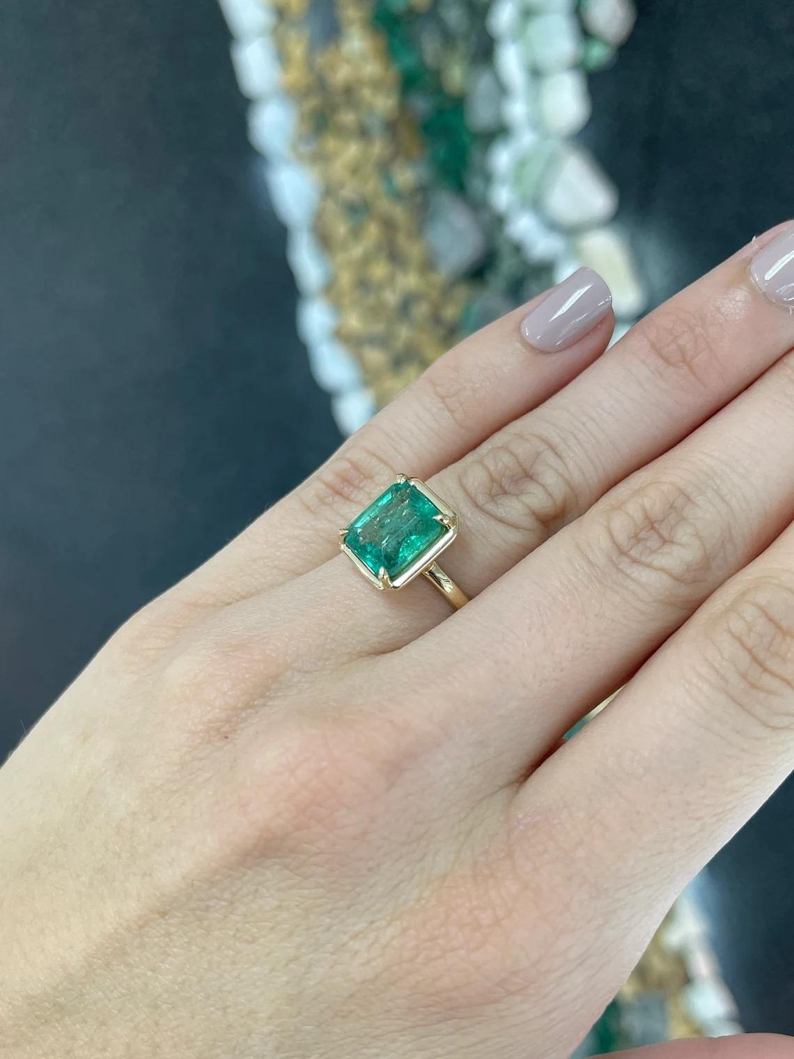4.35ct 14K Natural Mossy Green Emerald Cut Emerald 4 Prong Set Solitaire Ring In New Condition For Sale In Jupiter, FL