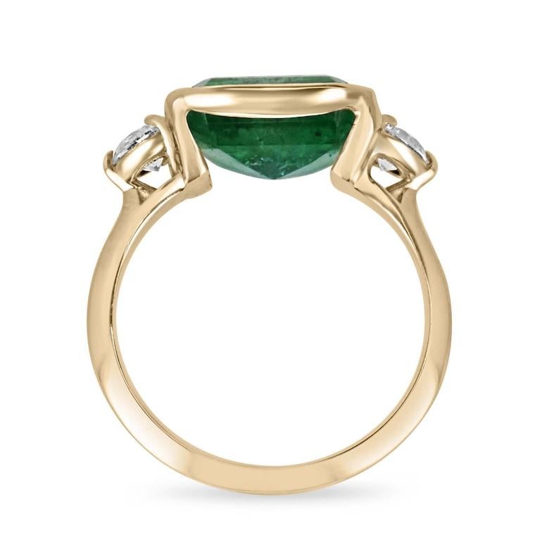 Elevate every moment with our Emerald and Diamond Three Stone Ring. Embracing a captivating 3.90-carat emerald cut emerald, elegantly placed east to west in a secure half-bezel setting, this ring radiates timeless charm. With its lush green hue and