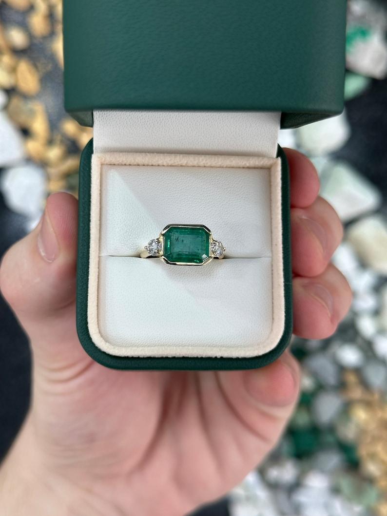 Modern 4.35tcw 14K Emerald Cut Emerald Diamond Engagement Ring For Sale