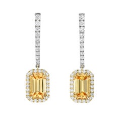 Pendientes colgantes de oro de 18 quilates y platino con topacio imperial de 4,36 quilates en talla esmeralda y diamantes