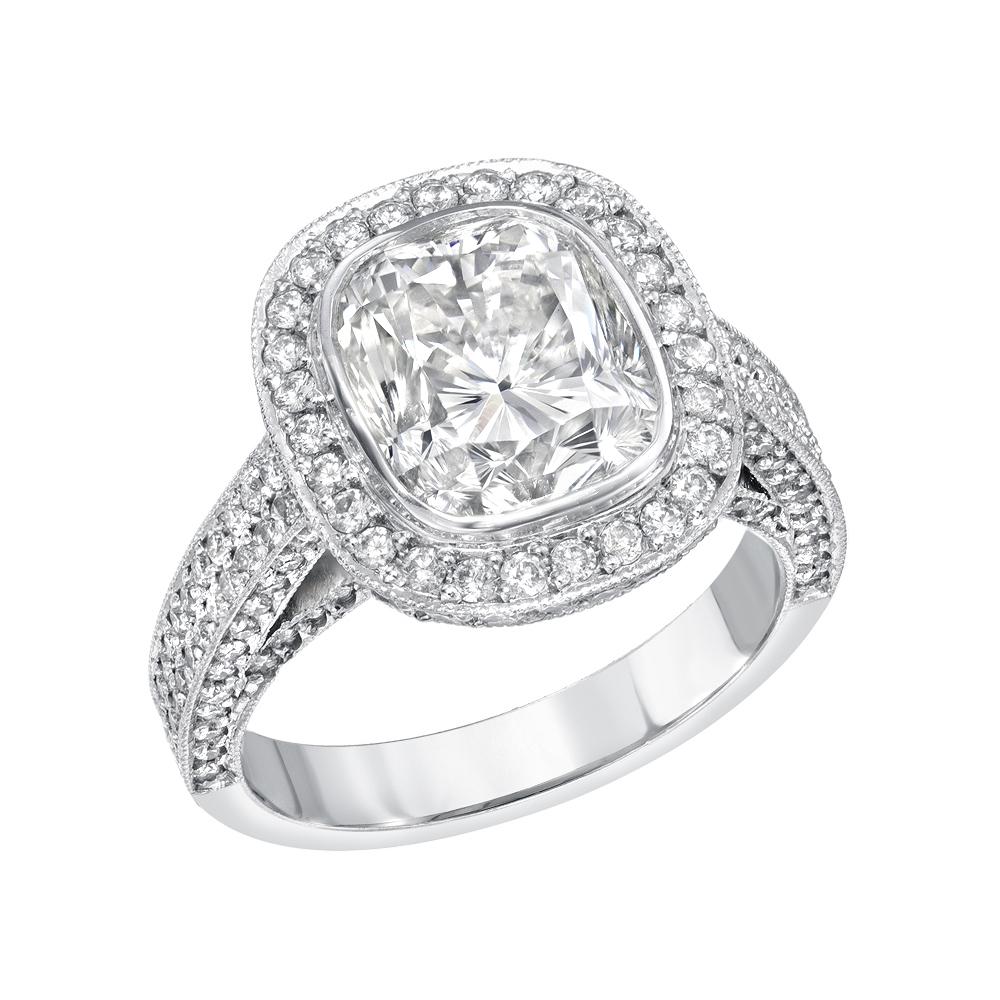 This magnificent bridal style ring features a 4.36 carat natural diamond Cushion cut in the center set by hand in a thin platinum bezel. The diamond is a J Color VS Clarity with EGL certification. It decorated with a pave diamonds around the center
