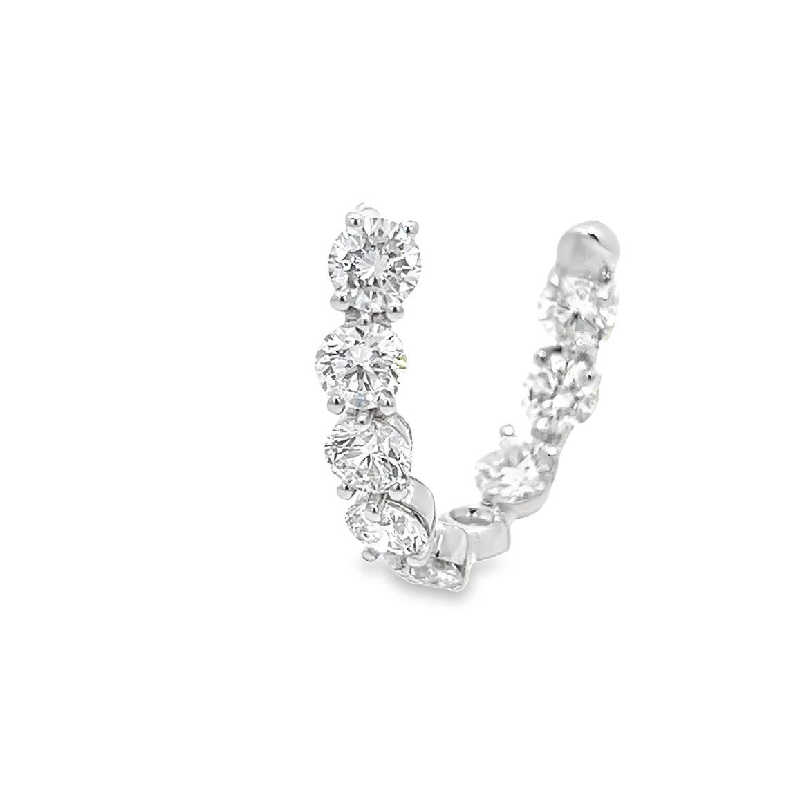 These diamond earrings are unlike anything you've ever seen before. They are the perfect statement piece for those who like to take risks and stand out from the crowd. With a unique and distinct setting, these earrings carry a total of 4.36 carats