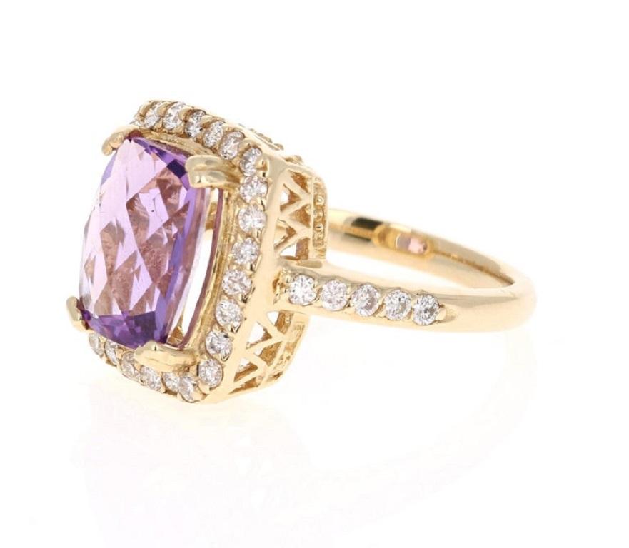 This beautiful ring has a 3.70 Carat Cushion Cut Amethyst and is surrounded by 36 Round Cut Diamonds that weigh 0.67 carats. The total weight of the ring is 4.37 carats. 

The ring is designed in 14K Yellow Gold and weighs approximately 6.1 grams.