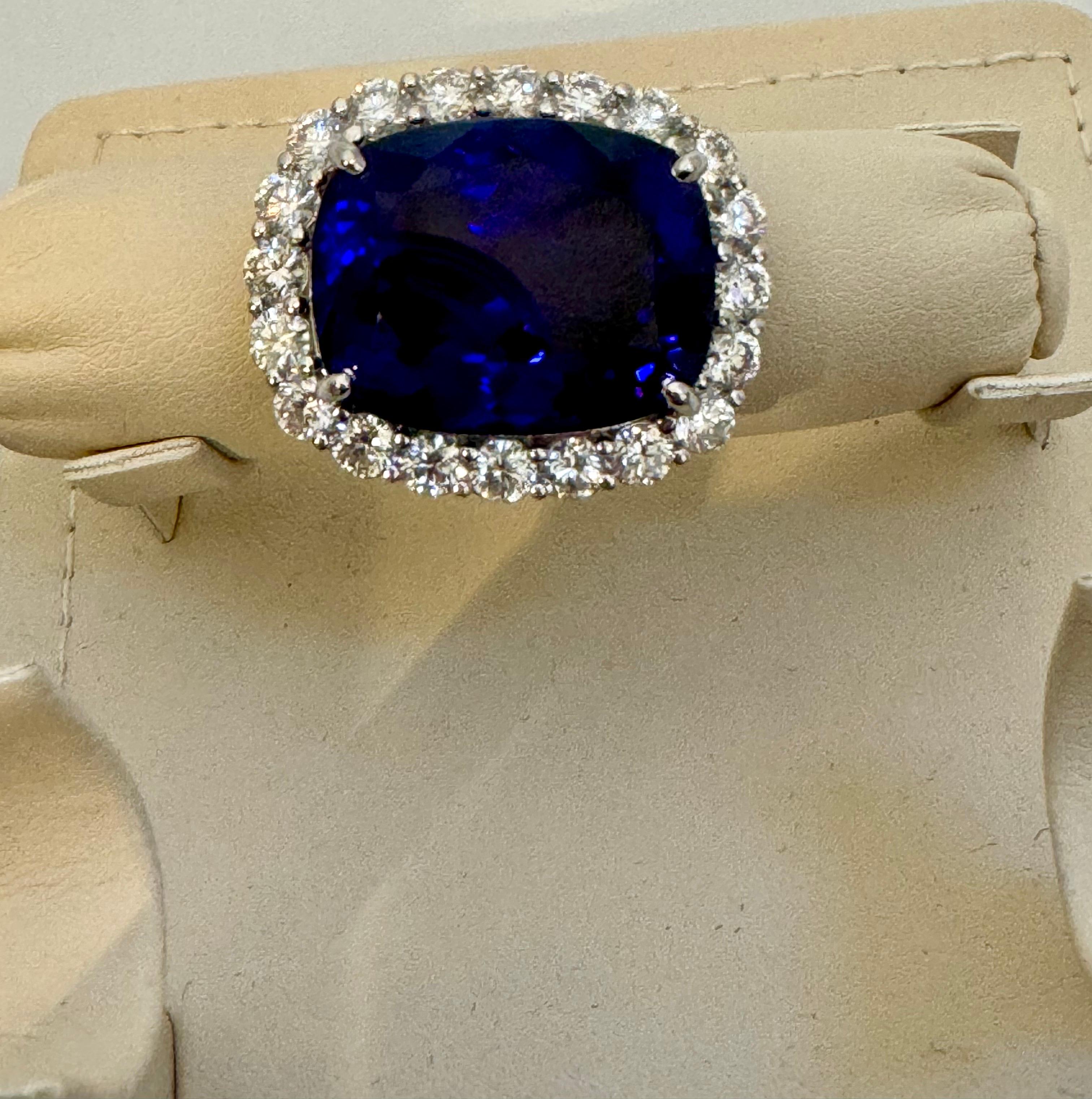 Extreme fine color and clarity.
This extraordinary, 43.74 carat tanzanite is truly an extraordinary gemstone. There are  total  of 4 carats of shimmering white brilliant cut round diamonds, this brilliant cushion-cut gem exhibits the rich