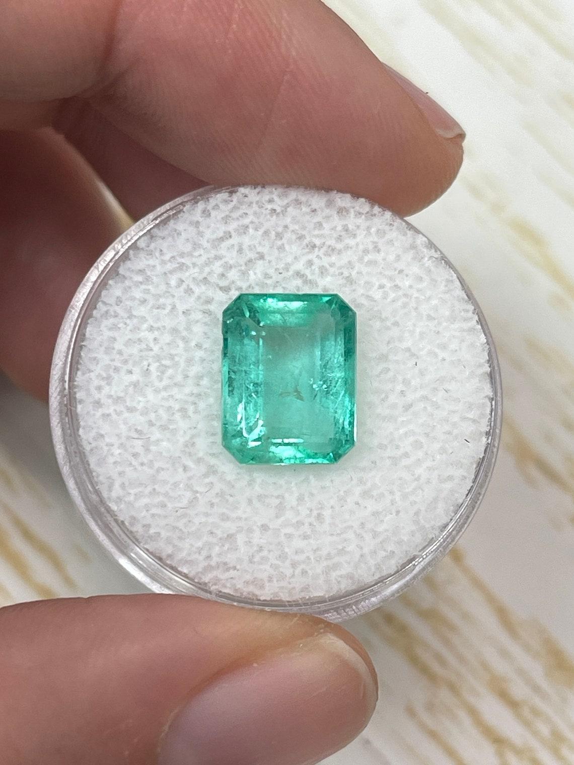Stone: Emerald
Weight: 4.37-carats
Shape: Emerald Cut
Clarity: Transparent
Luster: Good
Color: Medium Light Green
Measurements: 9.88mm x 7.44mm x 5.12mm
Geographic Origin: Colombia
Treatment: Natural, Oiling

Comments: Due to their growth conditions