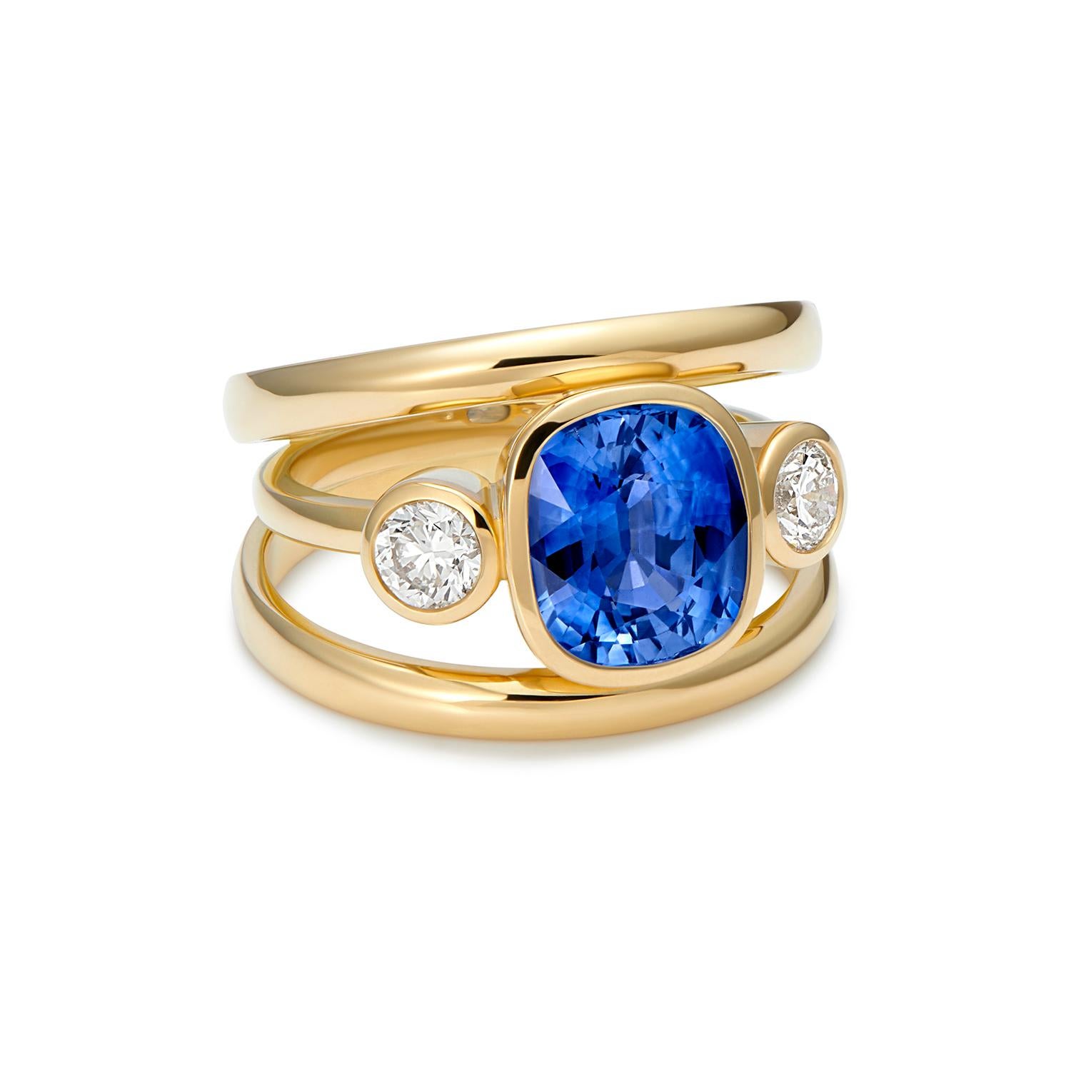 4.37ct Blue Sapphire 
0.65ct Diamonds 

A gorgeous Sri Lankan 4.37ct sapphire, cornflower blue and diamond ring 3 stone ring, set in 18kt yellow gold, hand made in England by exceptionally talented goldsmiths. 

We continue to make new pieces of