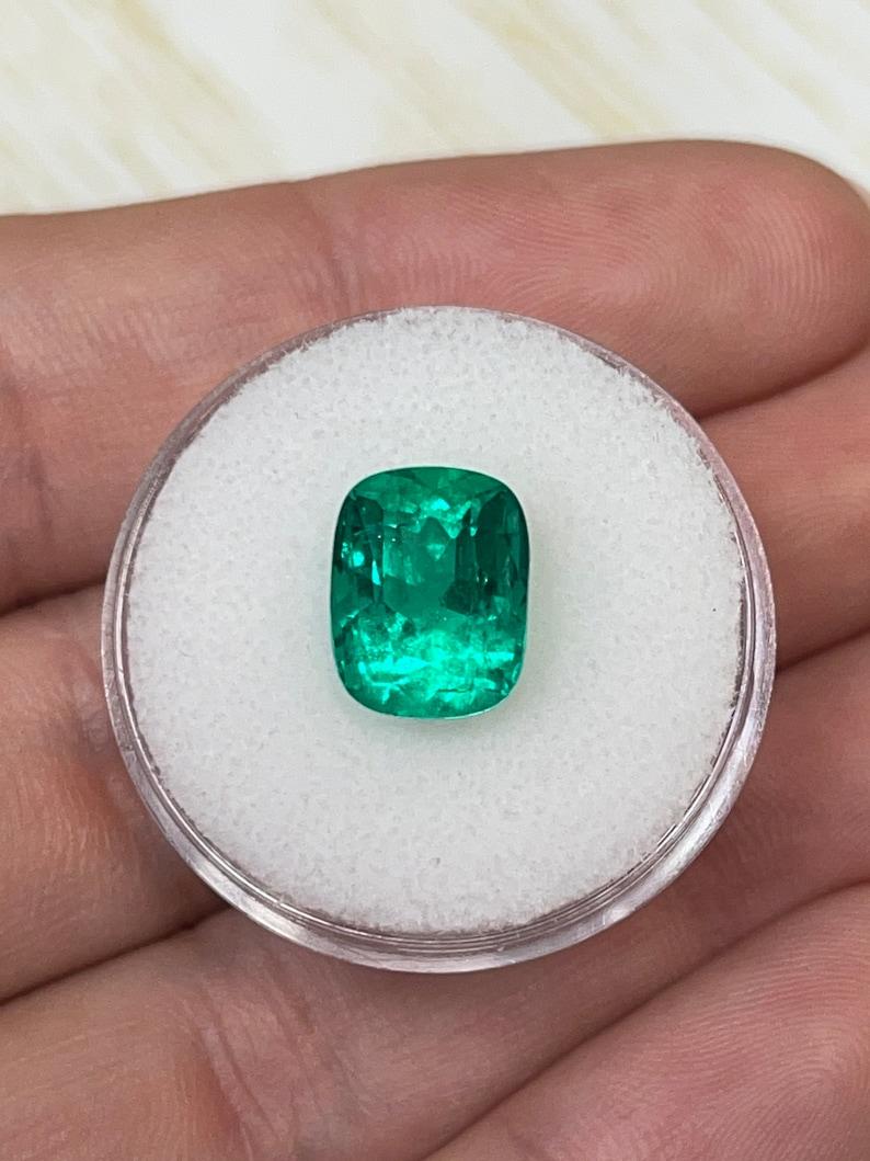 Stone: Emerald
Weight: 4.38-carats
Shape: Cushion Cut
Clarity: Transparent
Luster: Very Good
Color: Vivid Muzo Green
Measurements: 10.70mm x 8.35mm x 7.60mm
Geographic Origin: Colombia
Treatment: Natural, Oiling

Comments: Due to their growth