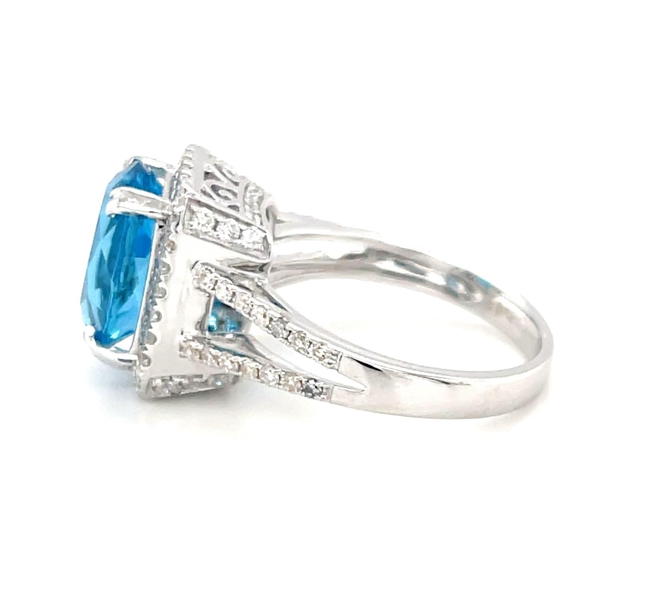 Oval Cut 4.38 Carat Blue Topaz and Diamond Halo Cocktail Ring in 18k White Gold  For Sale