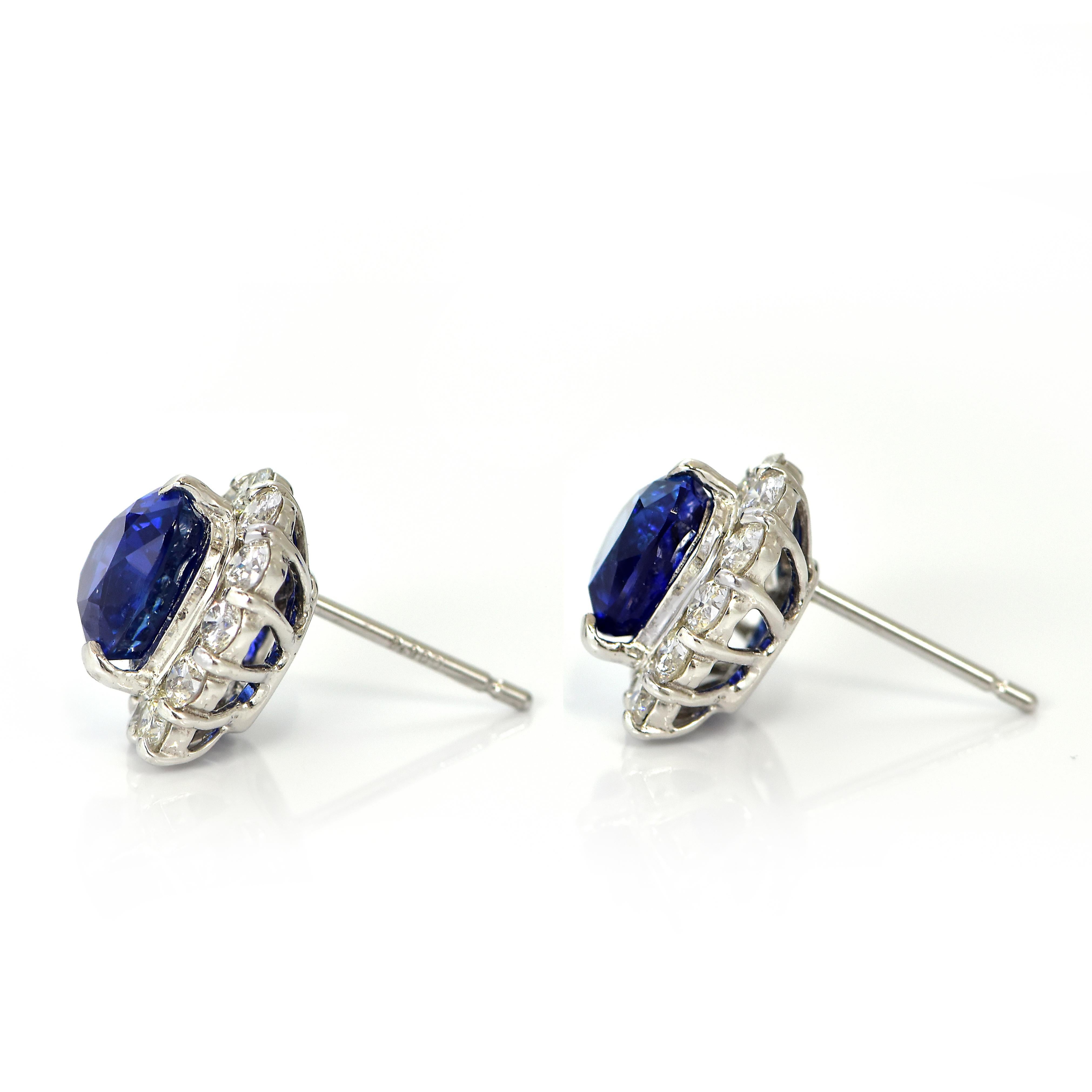 Oval Cut 4.38 Carats, Heart-Cut Royal Blue Sapphire and Diamond Earrings made in Platinum
