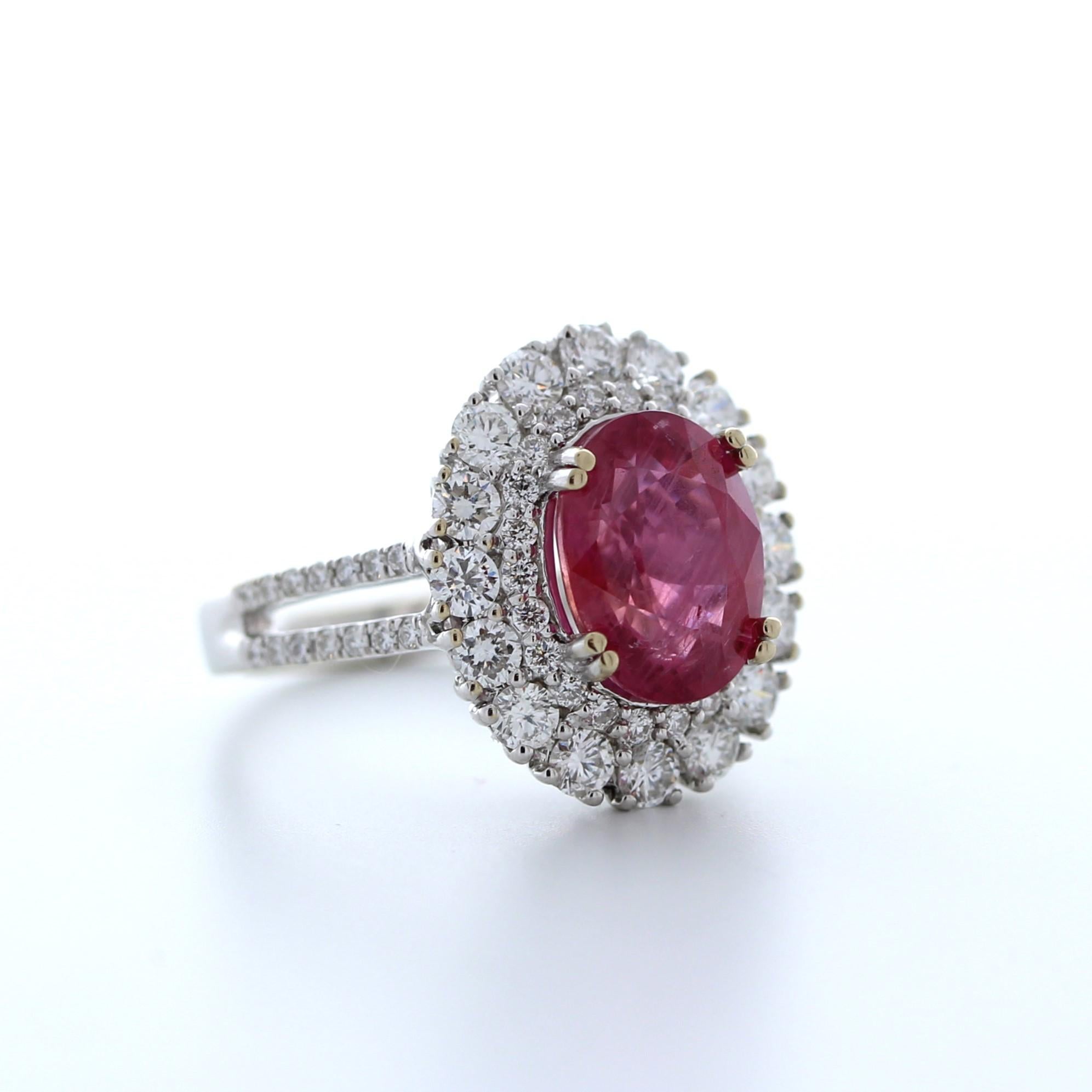 This magnificent 4.39 carat weight oval shape ruby fashion ring is a true showstopper. The vibrant red hue of the ruby is rich and intense, and the oval cut allows it to reflect light beautifully. Set in luxurious 18K white gold, the ruby is