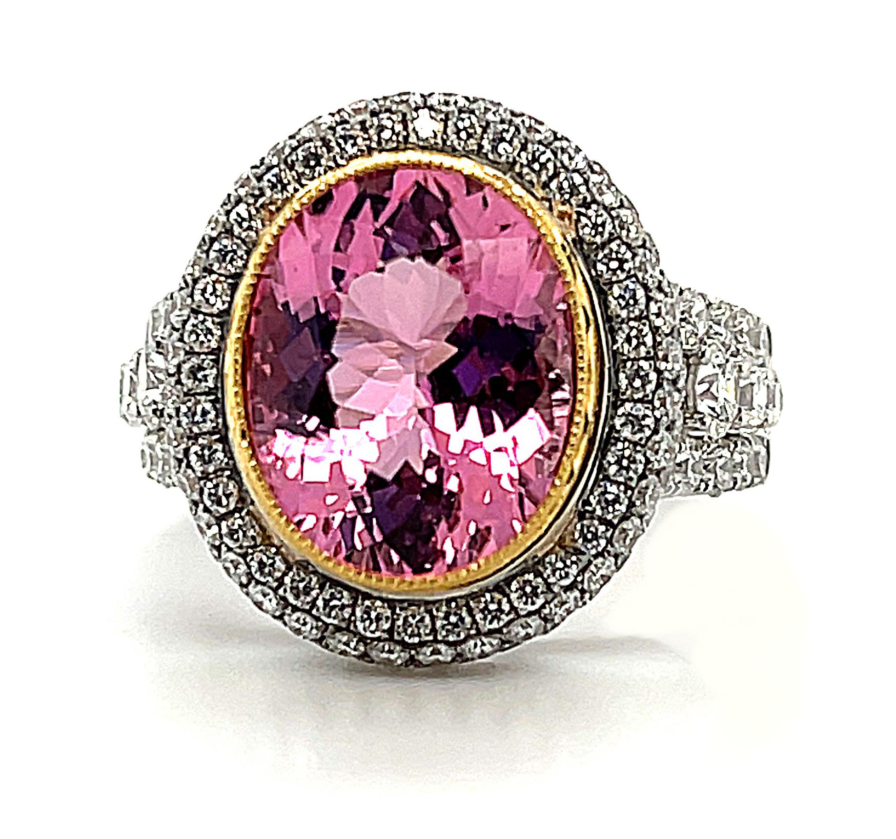 This ring is truly mouthwatering! It features a delicious pink tourmaline that looks like a piece of luscious hard candy. Round brilliant cut diamonds are pave set in concentric outlines that frame the beautiful center stone and add plenty of