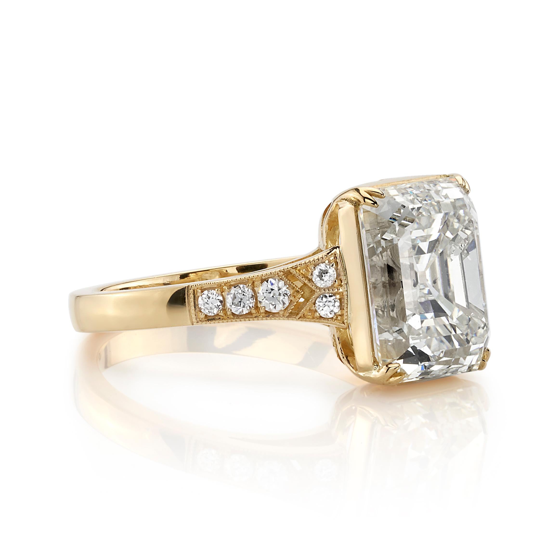 4.39ct M/SI1 GIA certified vintage Cushion cut diamond with 0.10ctw accent diamonds set in a handcrafted 18K yellow gold mounting. Ring is currently a size 6 and can be sized to fit.