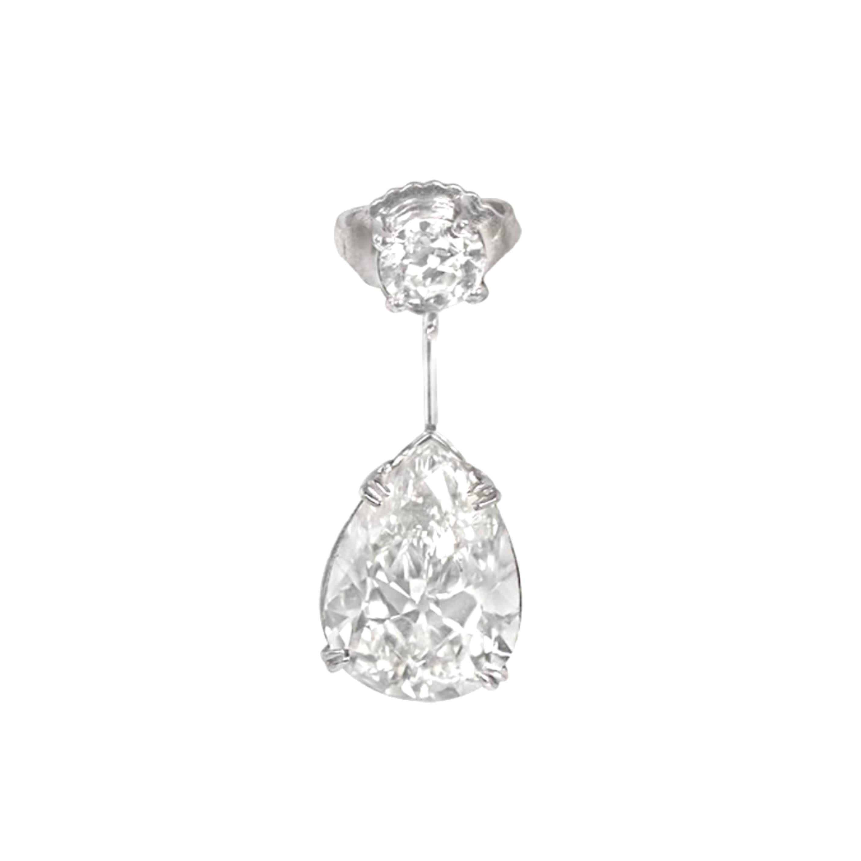 Indulge in the magnificence of our Exquisite platinum drop earrings, featuring prong-set pear-shaped diamonds. These earrings exude an aura of luxury and sophistication. The earring studs highlight smaller old European cut diamonds, delicately set