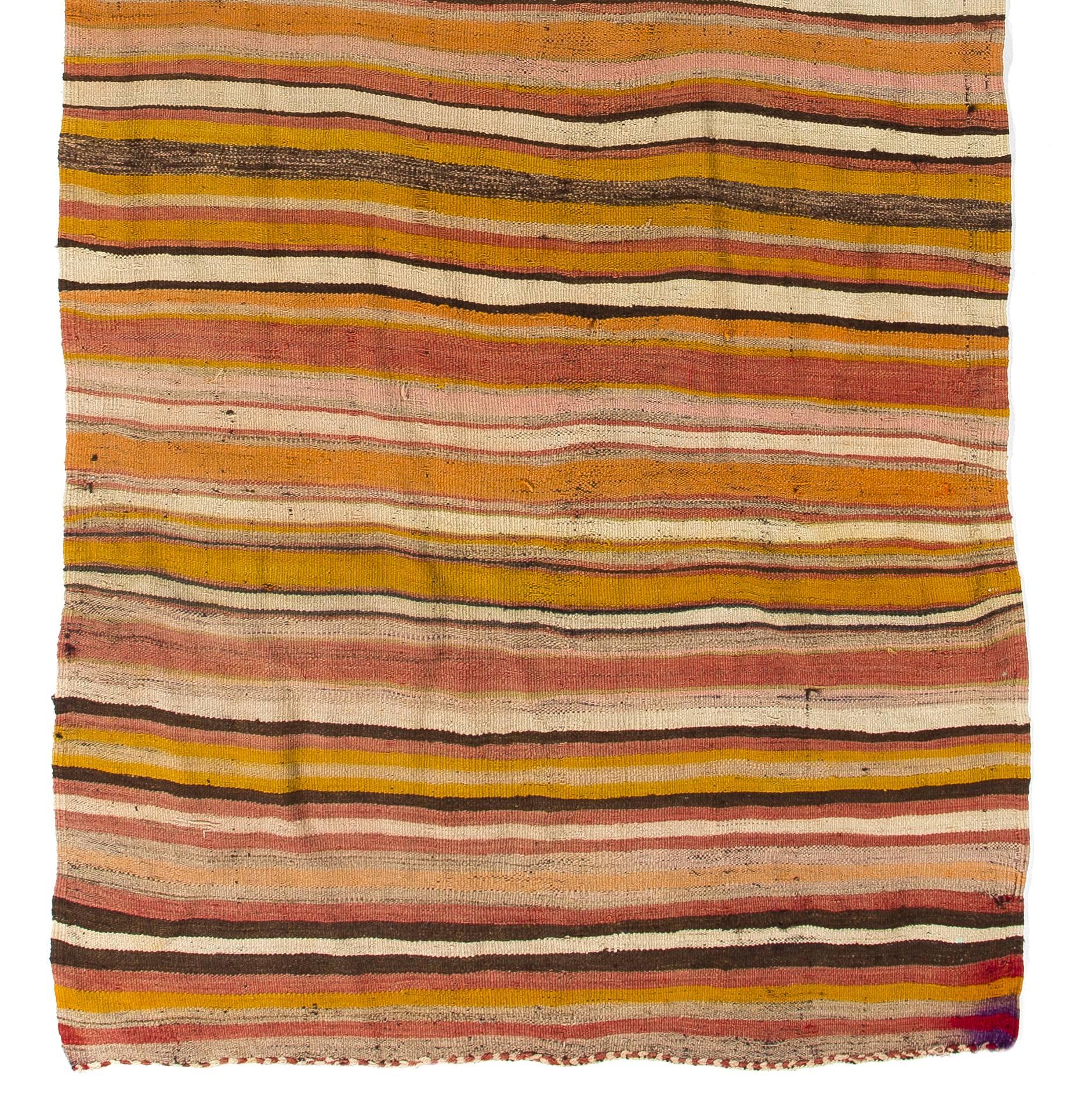 An authentic vintage hand-woven flat-weave (Kilim) rug from Central Turkey, made by the people of this region with traditionally nomadic roots, to be used as floor coverings in tents or highland lodges in the 1960s. 100% Wool. This particular kilim