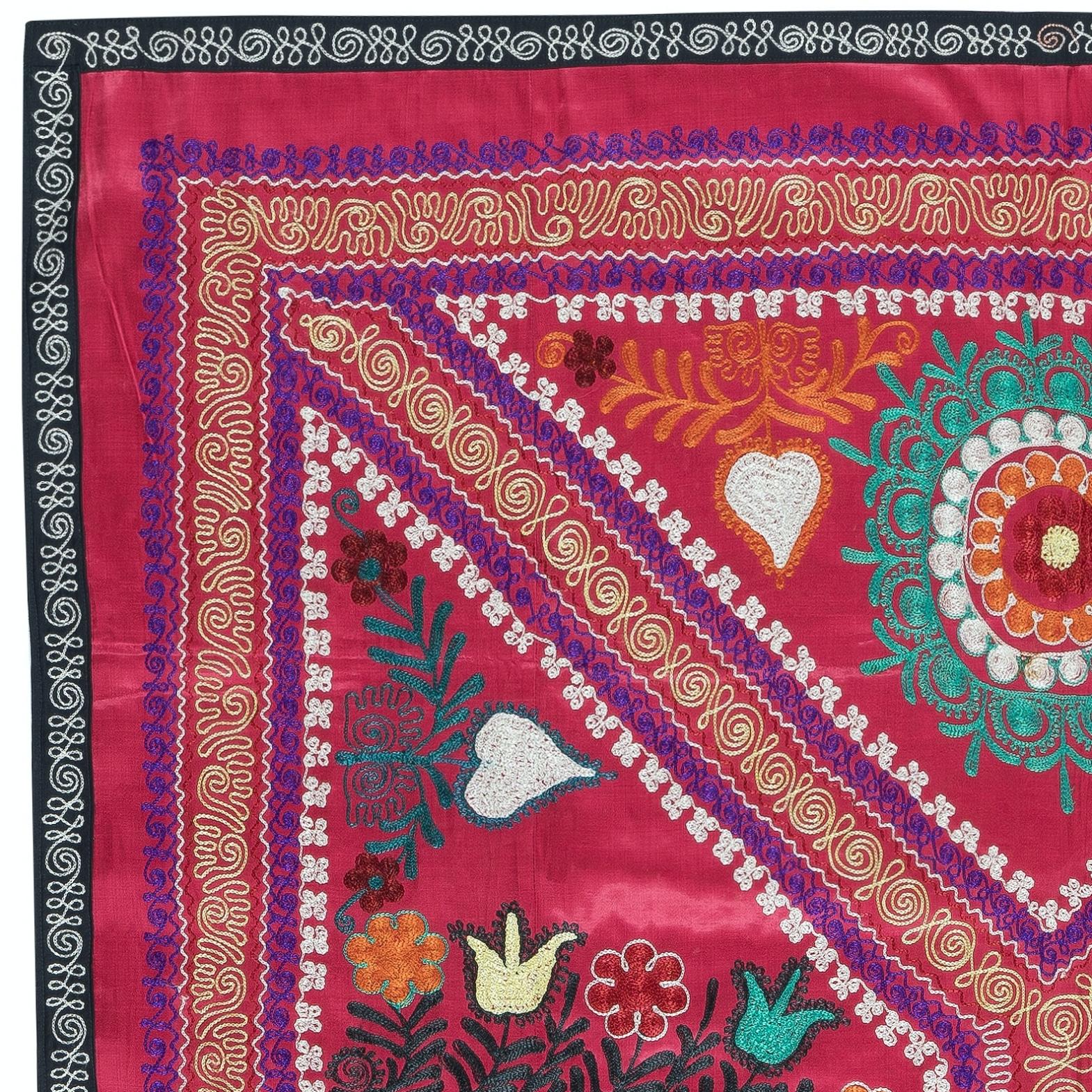 Introducing our exquisite new suzani hand embroidered wall hanging, a captivating piece that combines ancient craftsmanship with modern artistry. This embroidered cloth is not just a suzani throw, but a remarkable suzani wall hanging that will