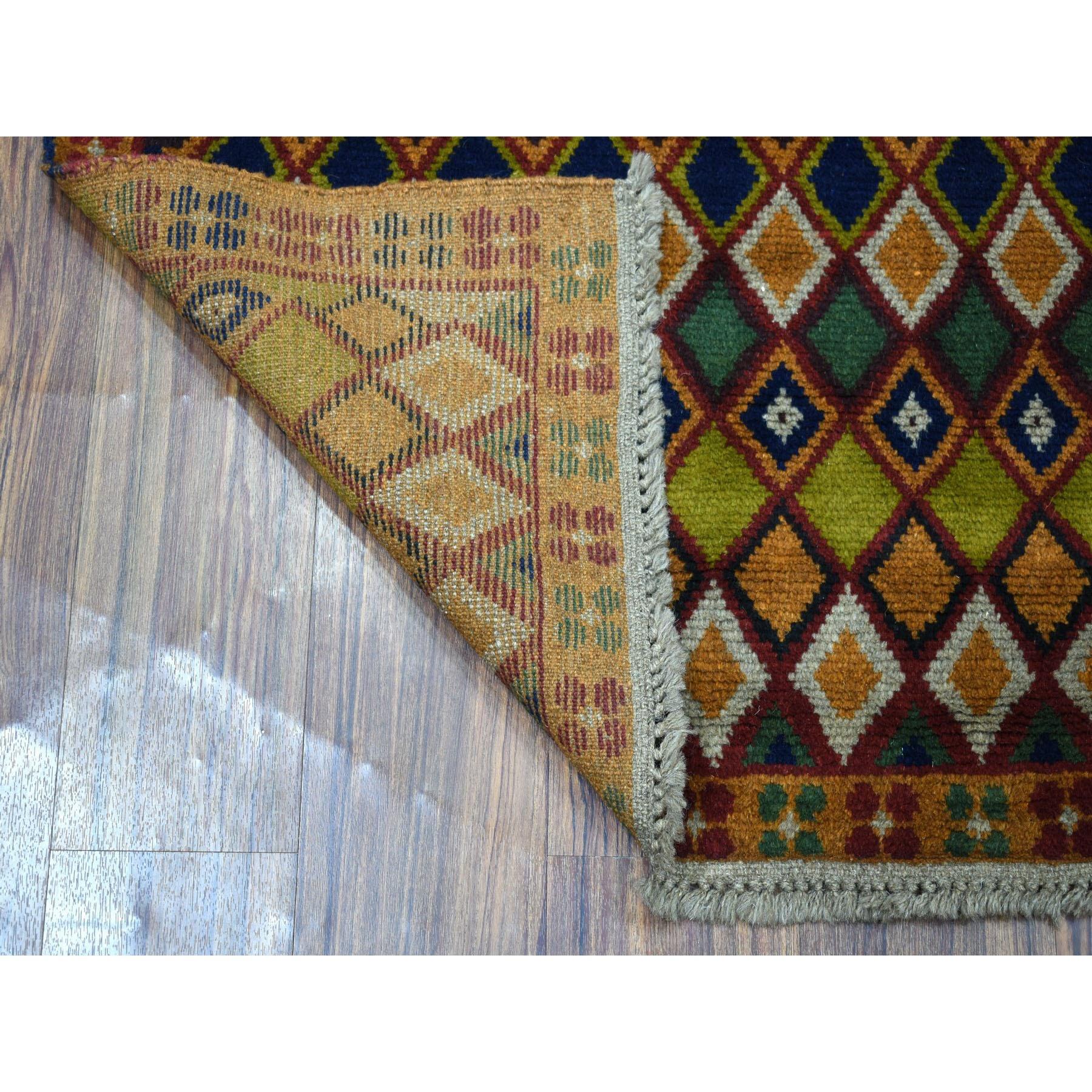 This is a truly genuine one-of-a-kind Brown Tribal Design Colorful Afghan Baluch Hand Knotted Pure Wool Oriental Rug. It has been woven for months and months in the centuries-old Persian weaving craftsmanship techniques by expert artisans.
Primary
