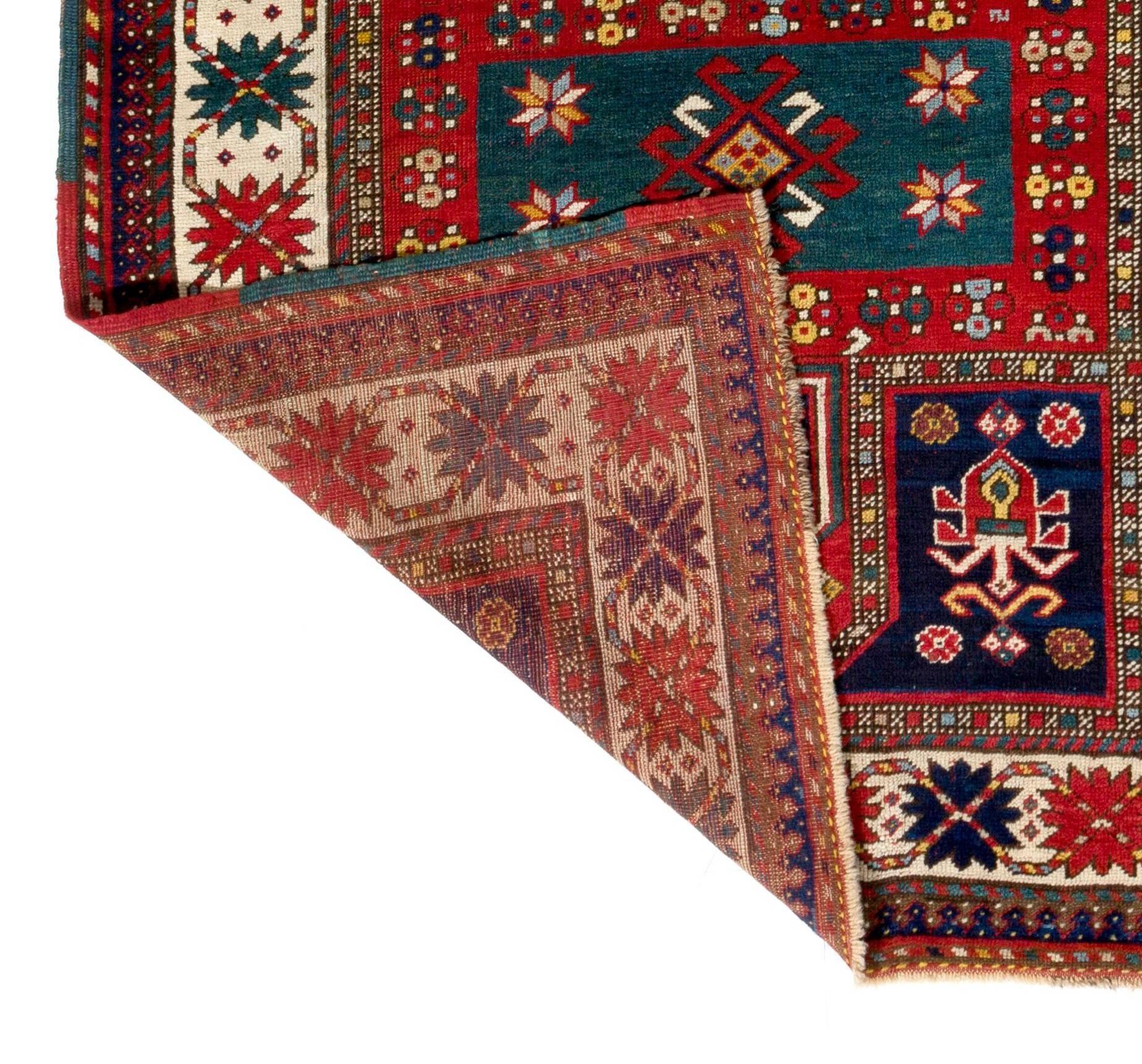 An antique Caucasian Kazak rug. Finely hand-knotted with even medium wool pile on wool foundation. Very good original condition. Sturdy and as clean as a brand new rug (deep washed professionally). 
Size: 4.3 x 9.6 Ft.