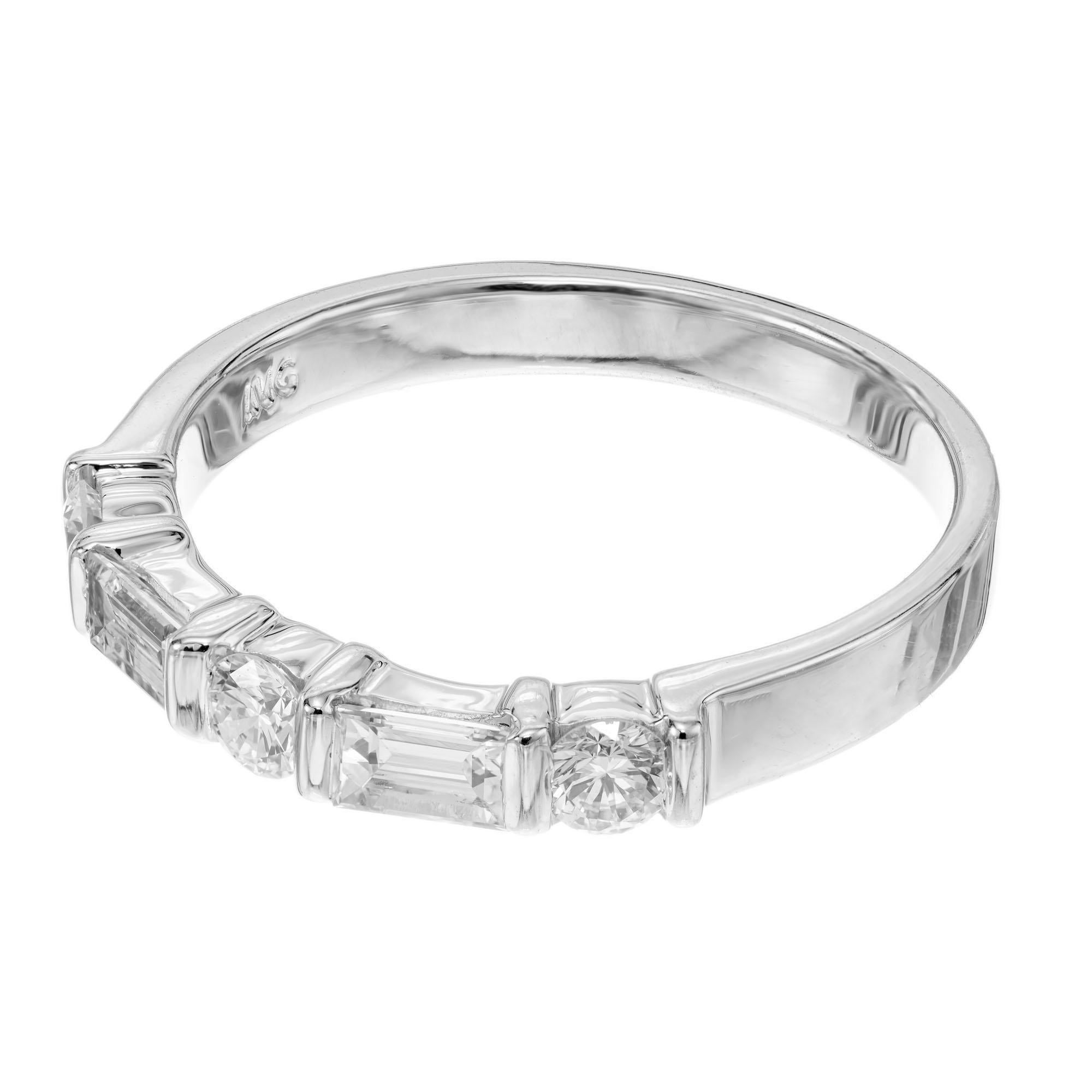 Diamond wedding band. 3 round diamonds separated by 2 baguette diamonds in a platinum setting. 

3 round diamonds approx. total weight: .24 F, VS
2 baguette diamonds approx. total weight: .20 F, VS
Size: 5.5 sizable
Platinum
Weight: 4.40 grams
