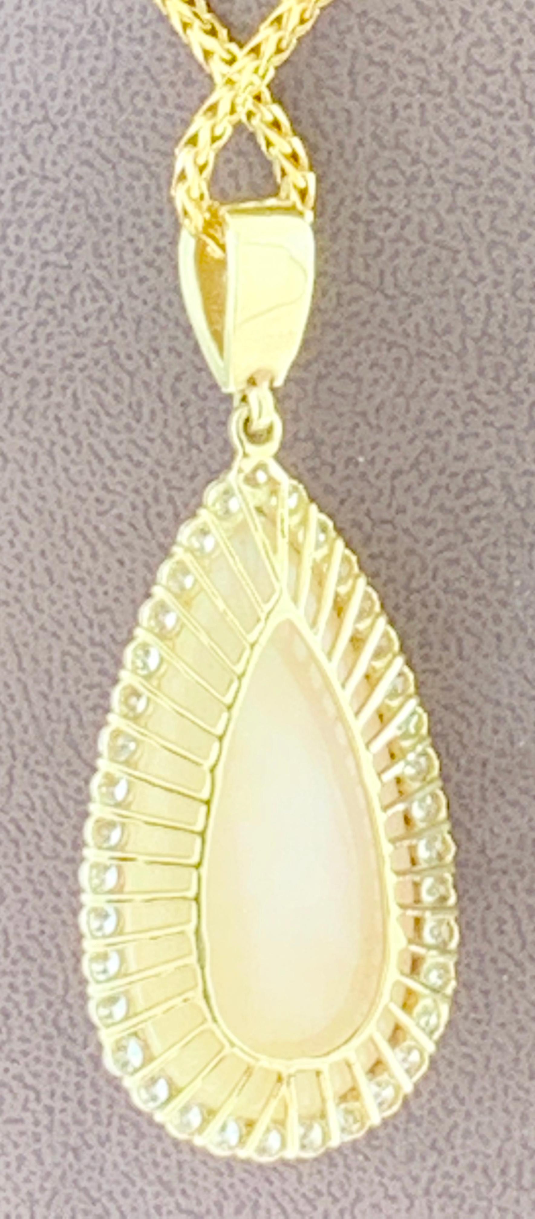  44 Carat  Pear Ethiopian  Opal &  Diamond Pendant /  Necklace 18 Karat yellow  Gold Estate
This spectacular Pendant Necklace  consisting of a single Pear  Shape Ethiopian  Opal Approximately 44 Carat.  The  Opal   is surrounded by approximately 