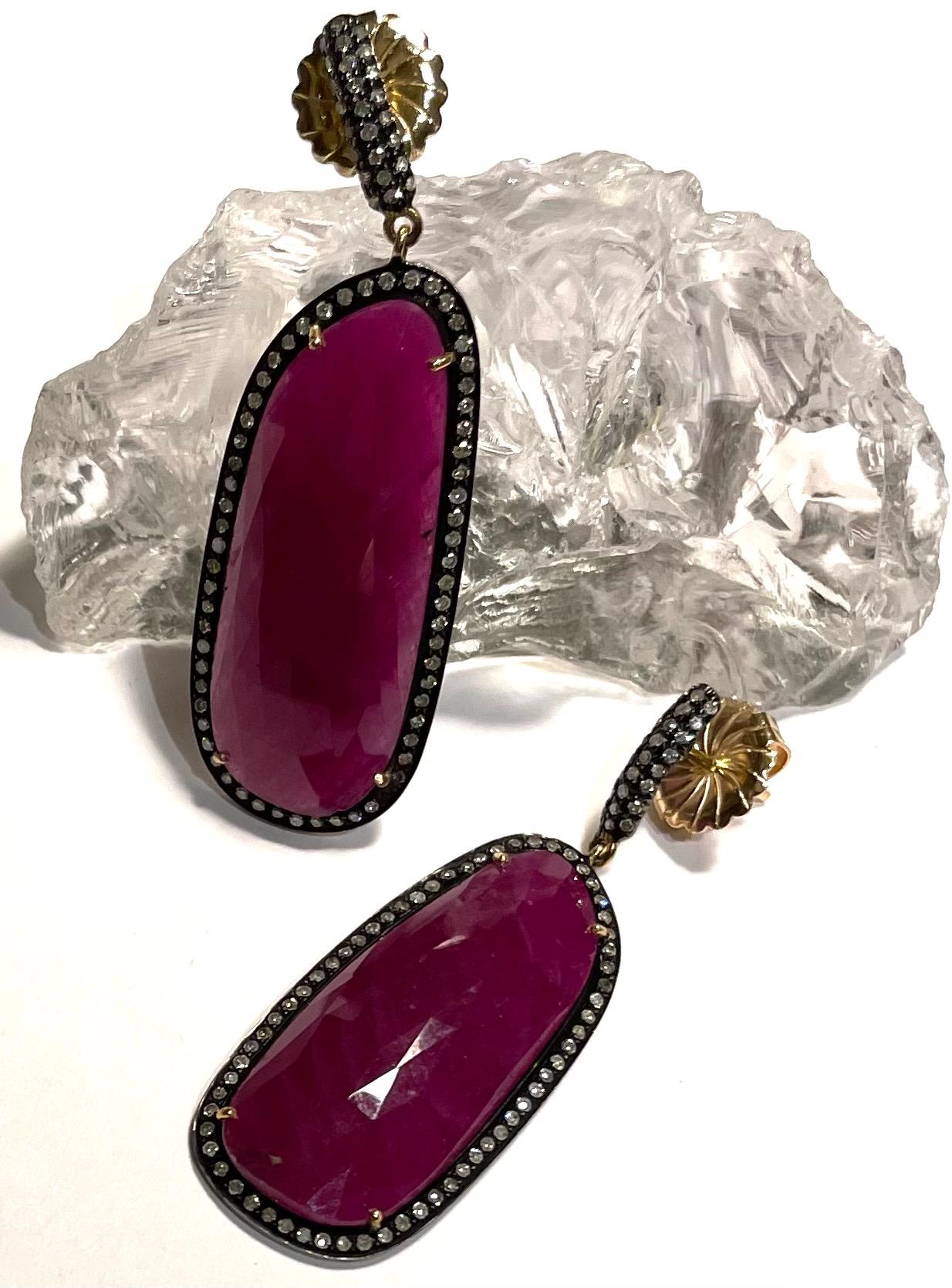 Description
Beautiful 44 carat Ruby earrings framed with pave diamonds
Item # E2788

Materials and Weight
Ruby, 14 x 33mm 43.15 carats, faceted.
Pave diamonds, 0.86 carats.
Posts and jumbo backs, 14k gold.
Black Rhodium sterling