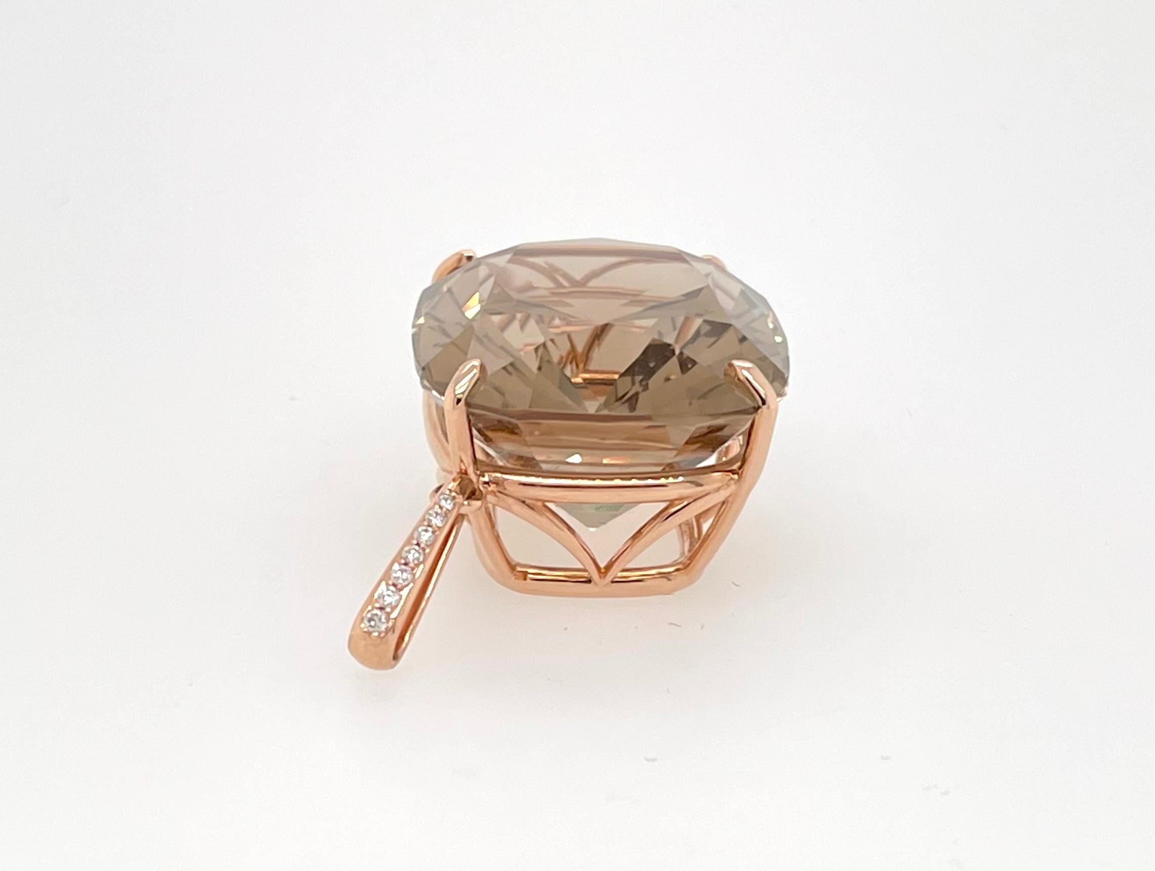 Stunning natural cushion cut smoky topaz by the spectacular gem Cutter Glen Preus.  Glen is a master lapidary and renowned for his work.  This natural, no heat cushion smokey topaz weighs 44.53 carats and is adorned with a 18K heavy Rose Gold