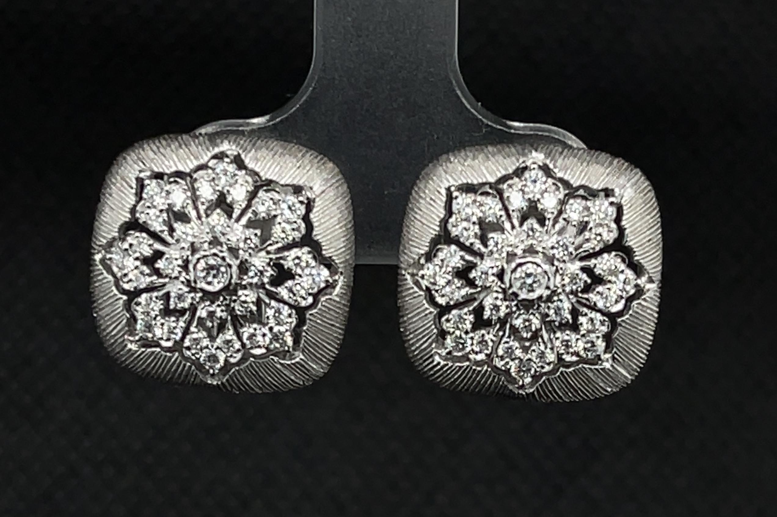 These Florentine inspired earrings feature bright, sparkling diamonds set in 18k white gold with French clip backs. Brilliant diamonds are set in a floral starburst against an exquisite hand-