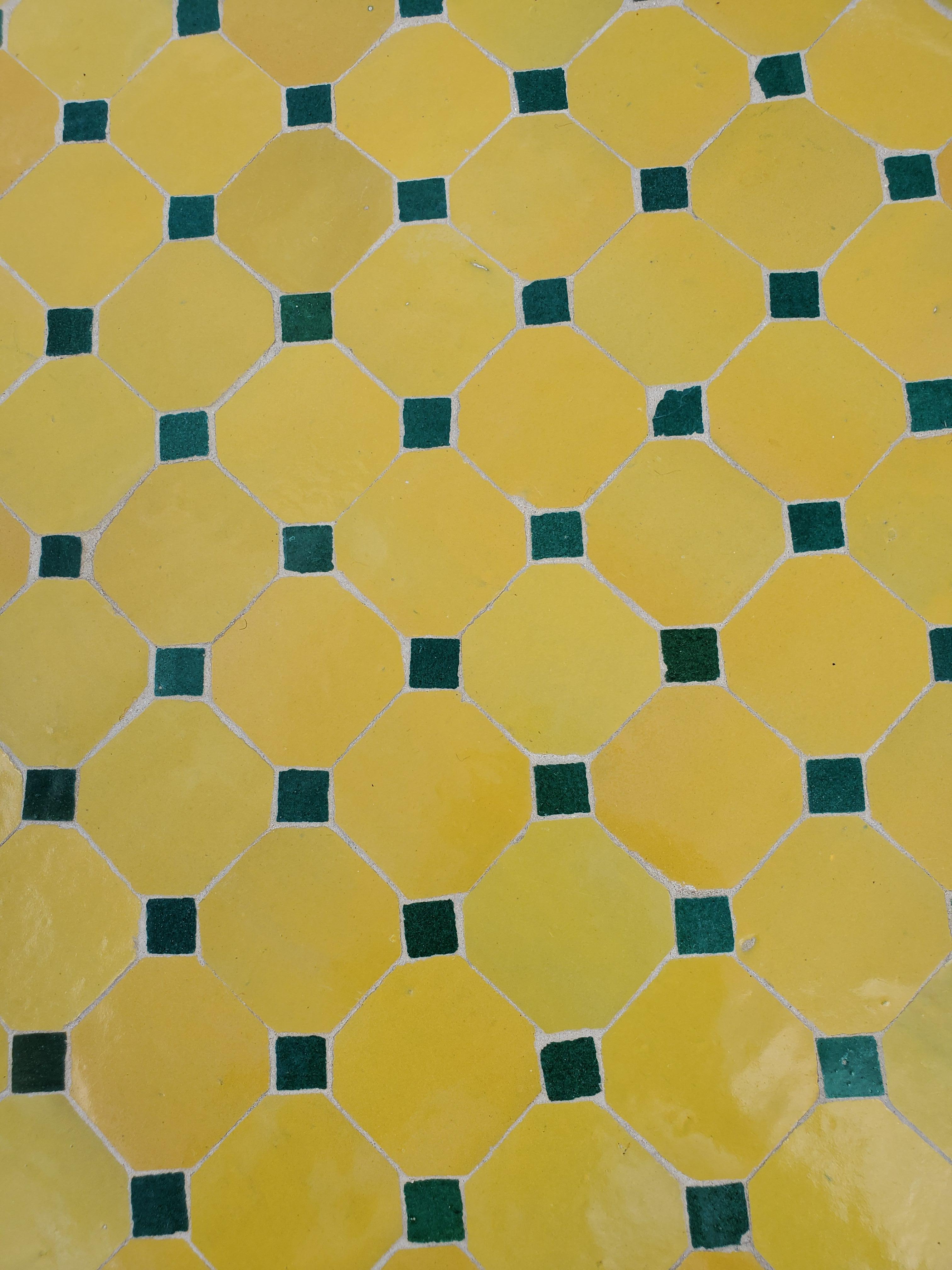 Yellow, black, and green squares and diamonds pattern Moroccan mosaic table measuring 44