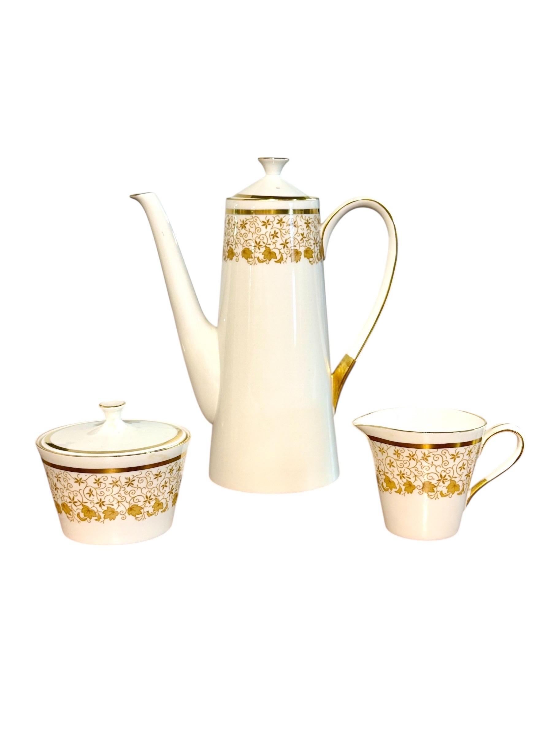 This refined 44-piece Royal Tuscan service exemplifies the elegance and craftsmanship for which English fine bone china is celebrated. Produced in England, the set features a crisp white porcelain body enriched with a beautifully detailed gilt