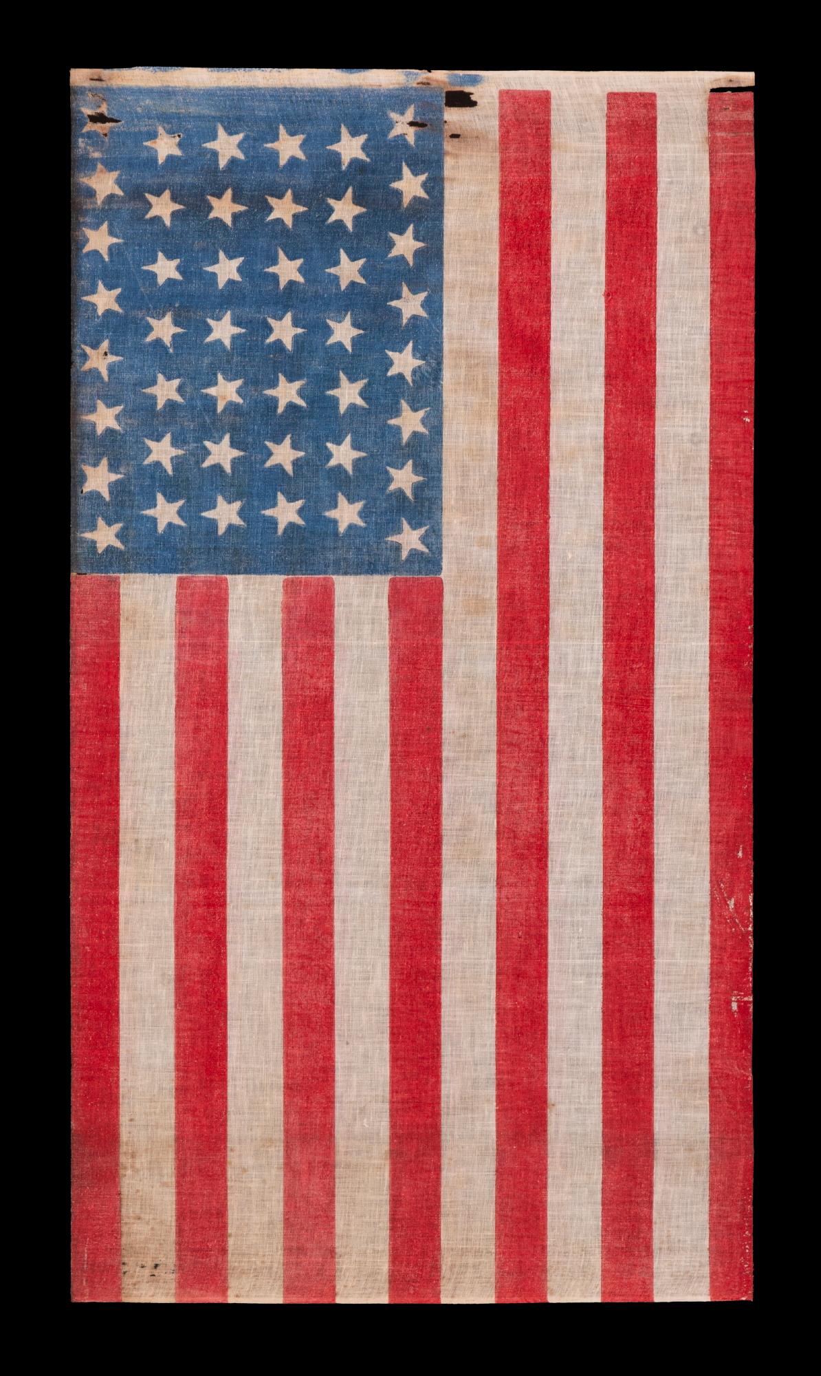 44 tumbling stars in an hourglass pattern, on an antique American flag with a striking, bright blue canton and scarlet stripes, reflects wyoming statehood, circa 1890-1896

44 star American parade flag, printed on coarse, glazed cotton. Wyoming