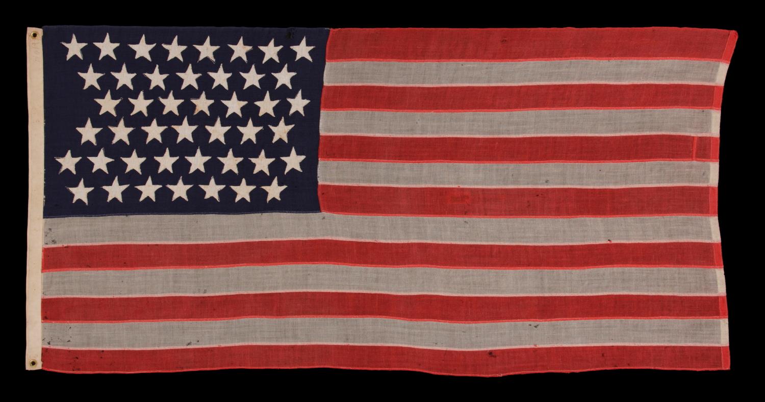 44 Stars in Zigzagging Rows on a Small Scale Antique American Flag with an Attractive, Elongated Profile, Wyoming Statehood, 1890-1896:

44 star American national flag, made in the period between 1890 and 1896. The stars are arranged in zigzagging
