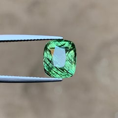 4.40 Carat Natural Green Peridot with Dense Ludwigite-Type Needle Inclusions