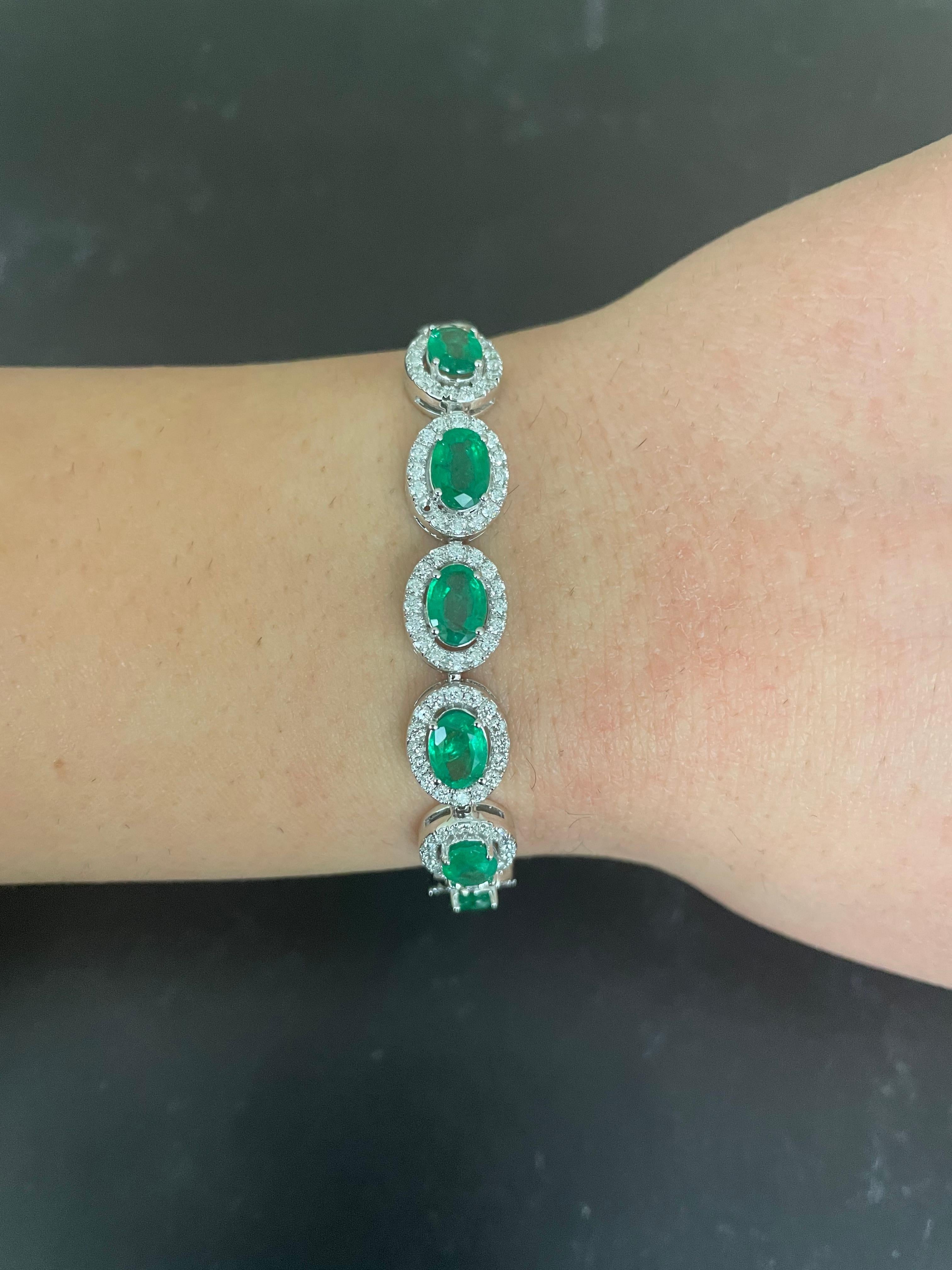 Stones: 7 Oval Emeralds at 4.40 Carats Total Weight
Accent Stones: 112 Round Brilliant Diamond 1.46 Carats Total Weight 
Clarity: SI / Color: H-I
Metal: 14K White Gold

Fine one-of-a-kind craftsmanship meets incredible quality in this breathtaking