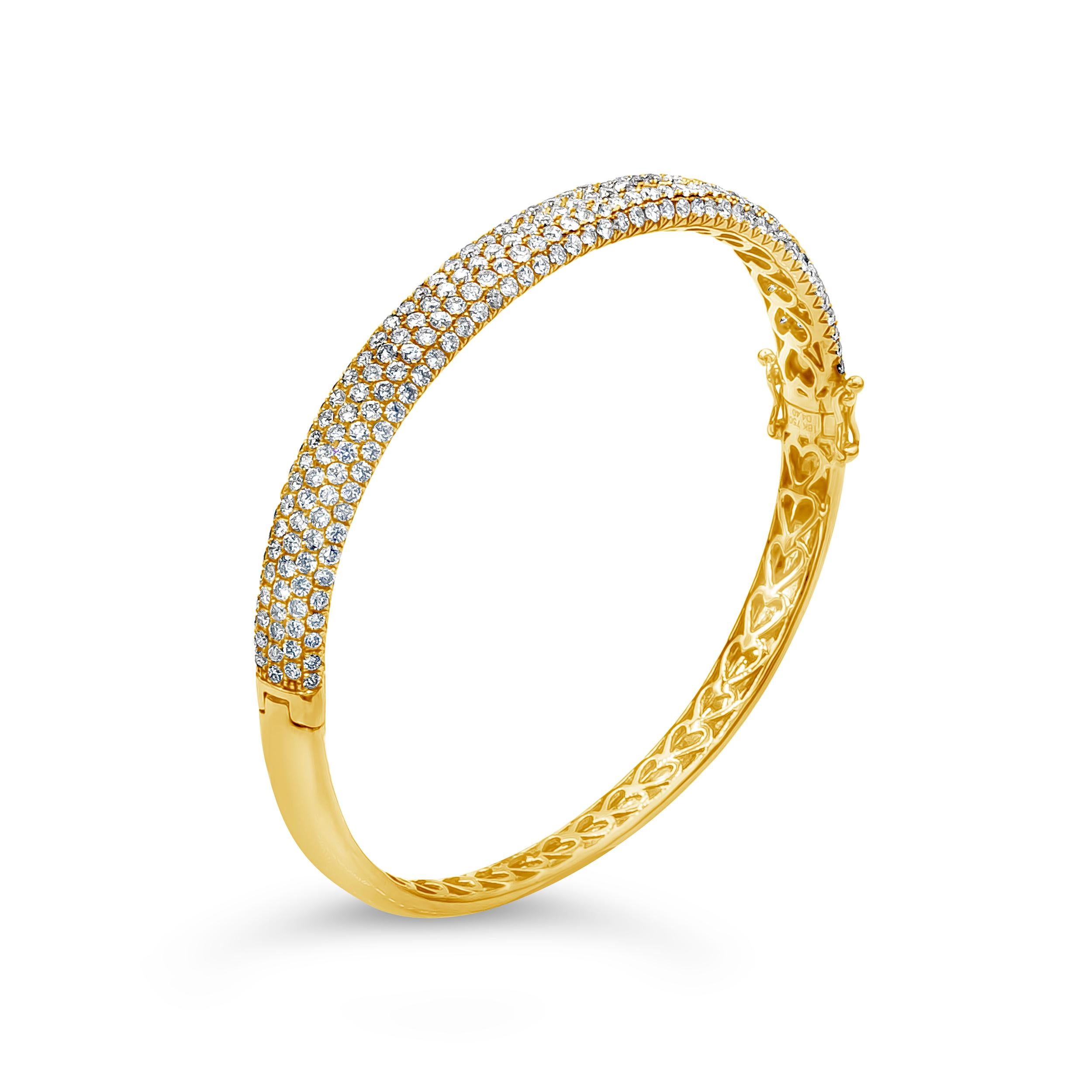 Showcasing a beautiful concave bangle bracelet micro-pave set with 250 round brilliant diamonds. Diamonds weigh 4.40 carats total. Made in 18K Yellow Gold.

Roman Malakov is a custom house, specializing in creating anything you can imagine. If you