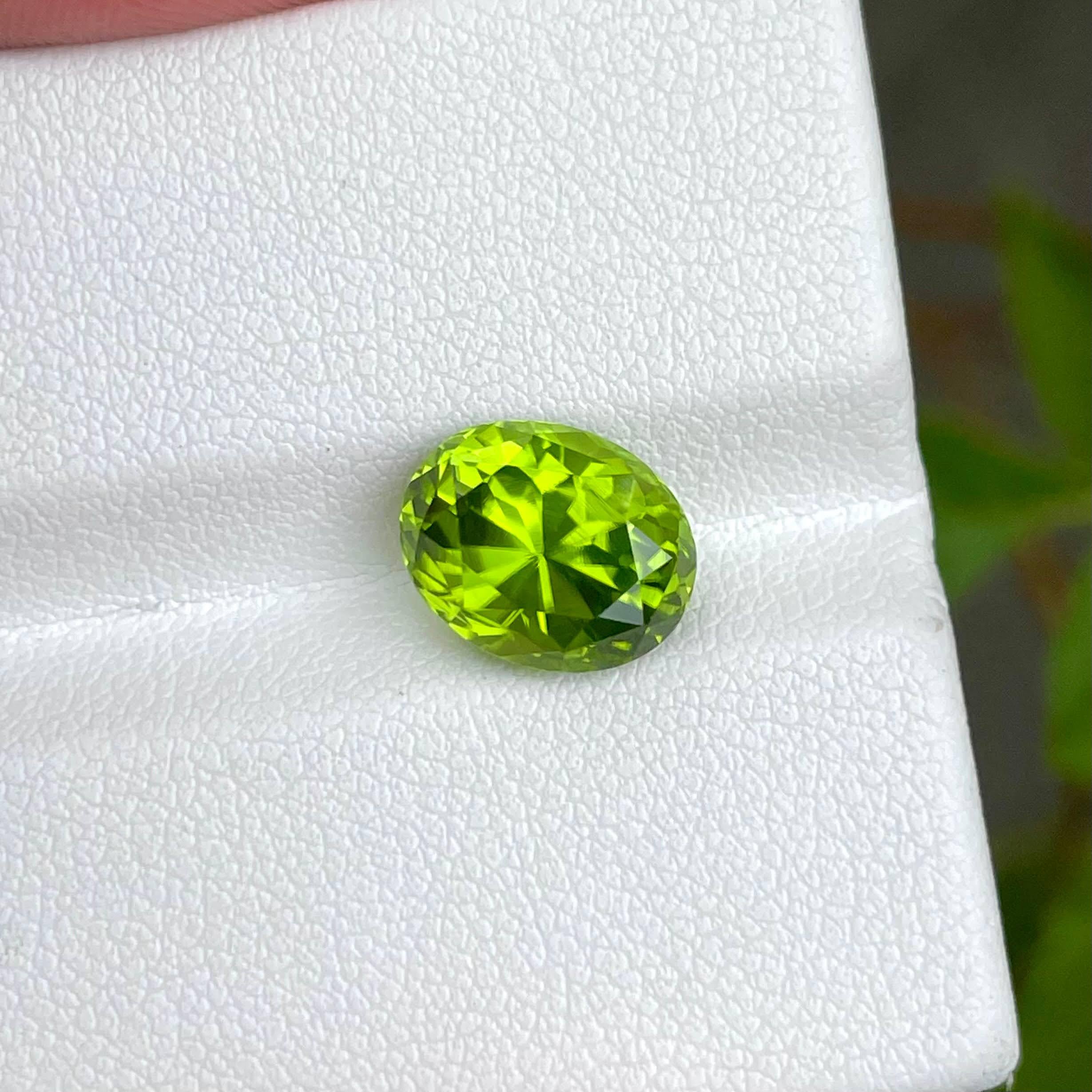 Weight 4.40 carats 
Dimensions 10.7x8.5x7.1 mm
Treatment none 
Origin Pakistan 
Clarity eye clean 
Shape oval 
Cut custom precision 




Behold the enchanting allure of a 4.40-carat Apple Green Peridot, delicately fashioned into an elegant oval