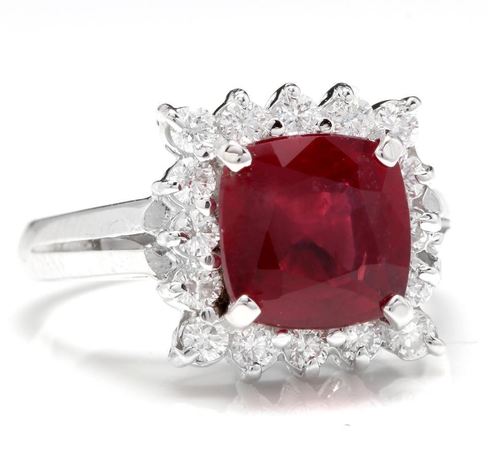 4.40 Carats Impressive Red Ruby and Natural Diamond 14K White Gold Ring

Total Red Ruby Weight is: Approx. 3.80 Carats

Ruby Treatment: Lead Glass Filling

Ruby Measures: Approx. 8.00 x 8.00mm

Natural Round Diamonds Weight: Approx. 0.60 Carats