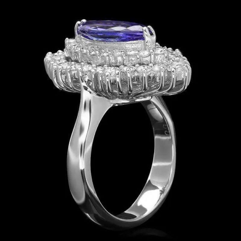 4.40 Carats Natural Tanzanite and Diamond 14K Solid White Gold Ring

Total Natural Tanzanite Weight is: Approx. 3.00 Carats 

Tanzanite Measures: Approx. 13.00 x 6.00mm

Natural Round Diamonds Weight: Approx. 1.40 Carats (color G-H / Clarity