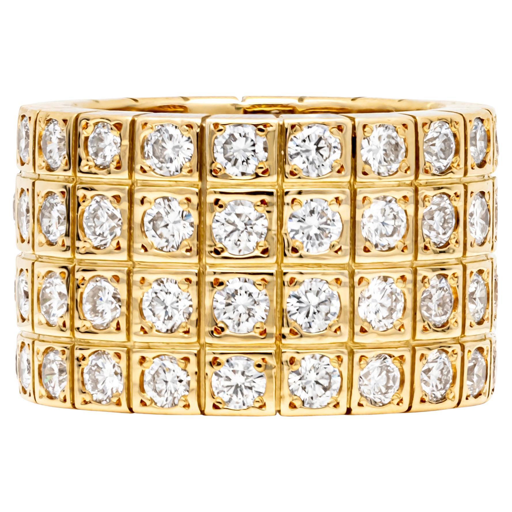 A fashionable eternity ring showcasing four rows of round brilliant diamonds, pave/bezel set in 18K Yellow Gold. Total weight of diamonds is 4.40 carats and approximately F color, VS clarity.  Can be worn as an everyday ring or in any special