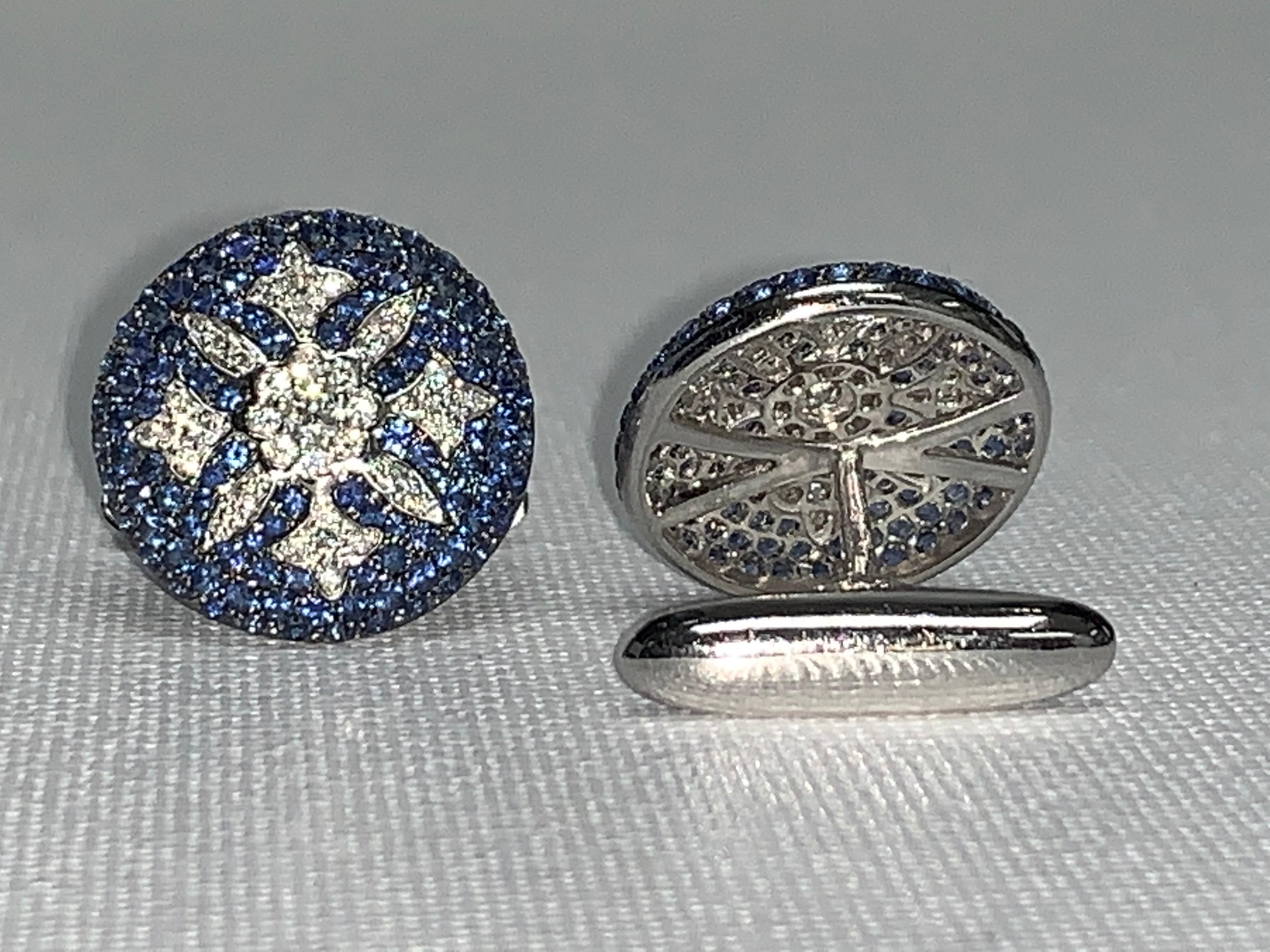 For the Gentleman whom owns everything anything he wants.  This is a unique and one-of-a-kind set of Custom Designed and Handmade Cuff links that he will be proud to wear and own.

18K White Gold
4.41 Carat Blue and White Diamonds

We specialize in