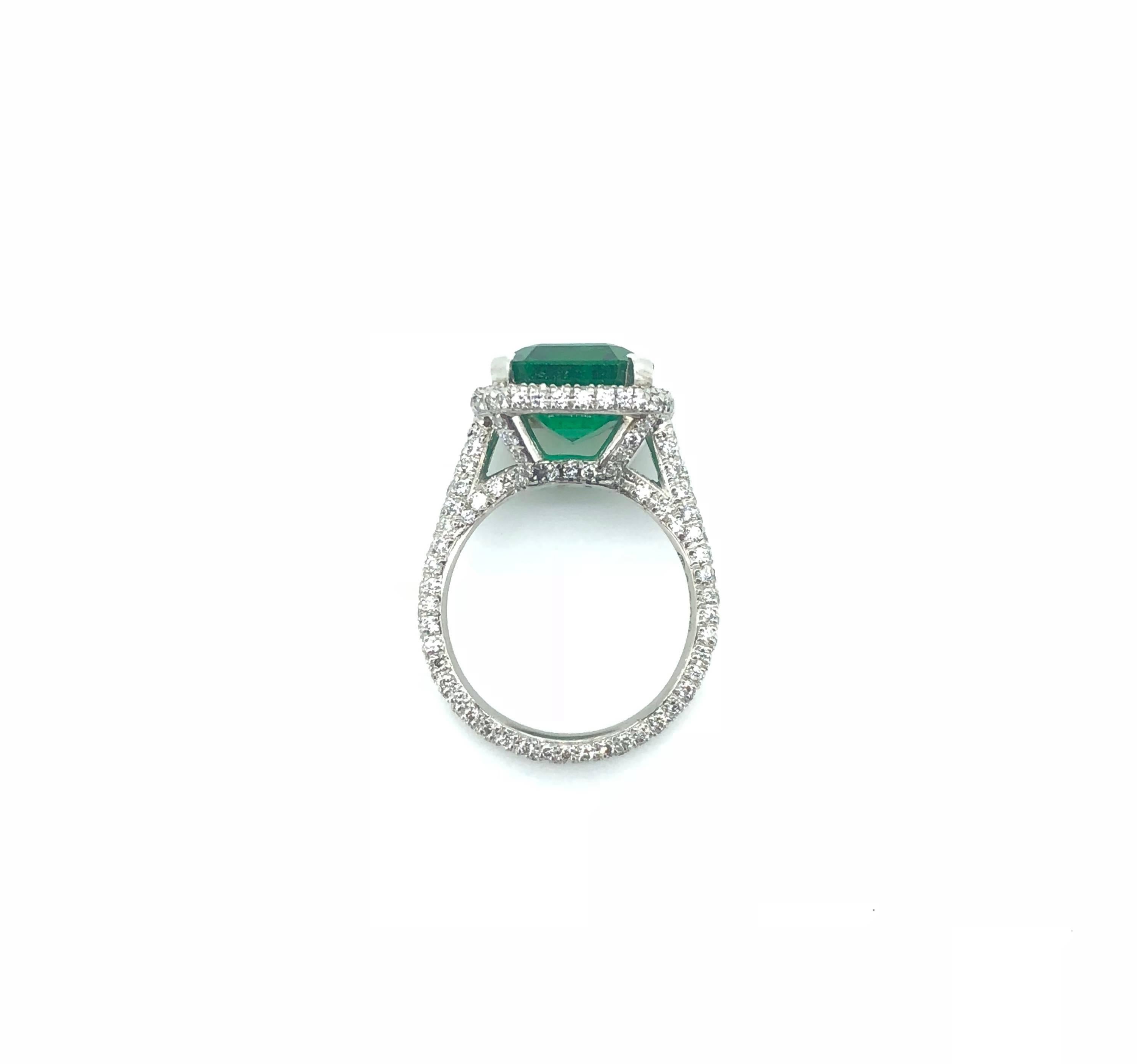 Modern 4.41 Carat Emerald Diamond Cluster Ring For Sale